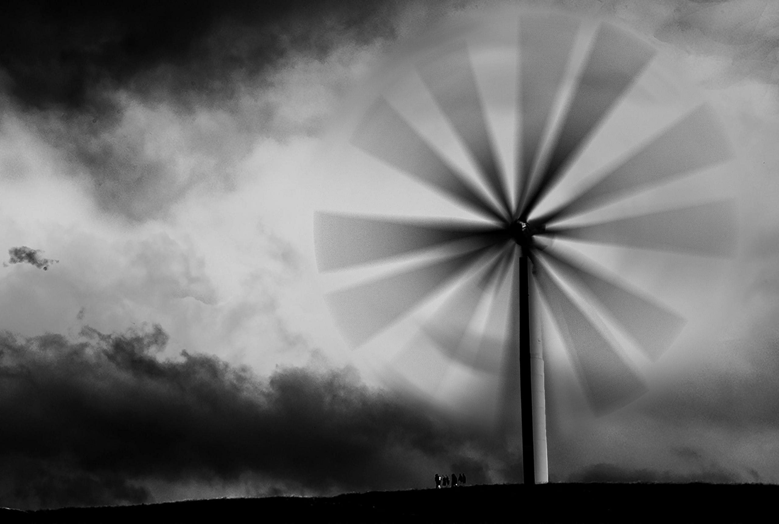 A composite photograph or a wind turbine