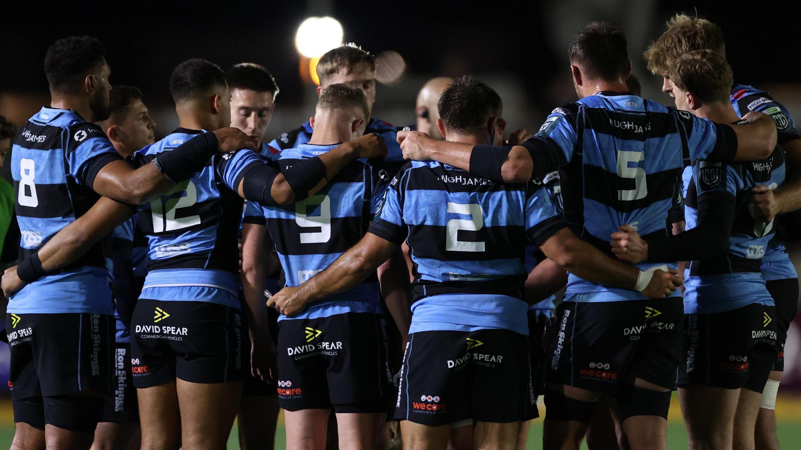 Cardiff players in a huddle