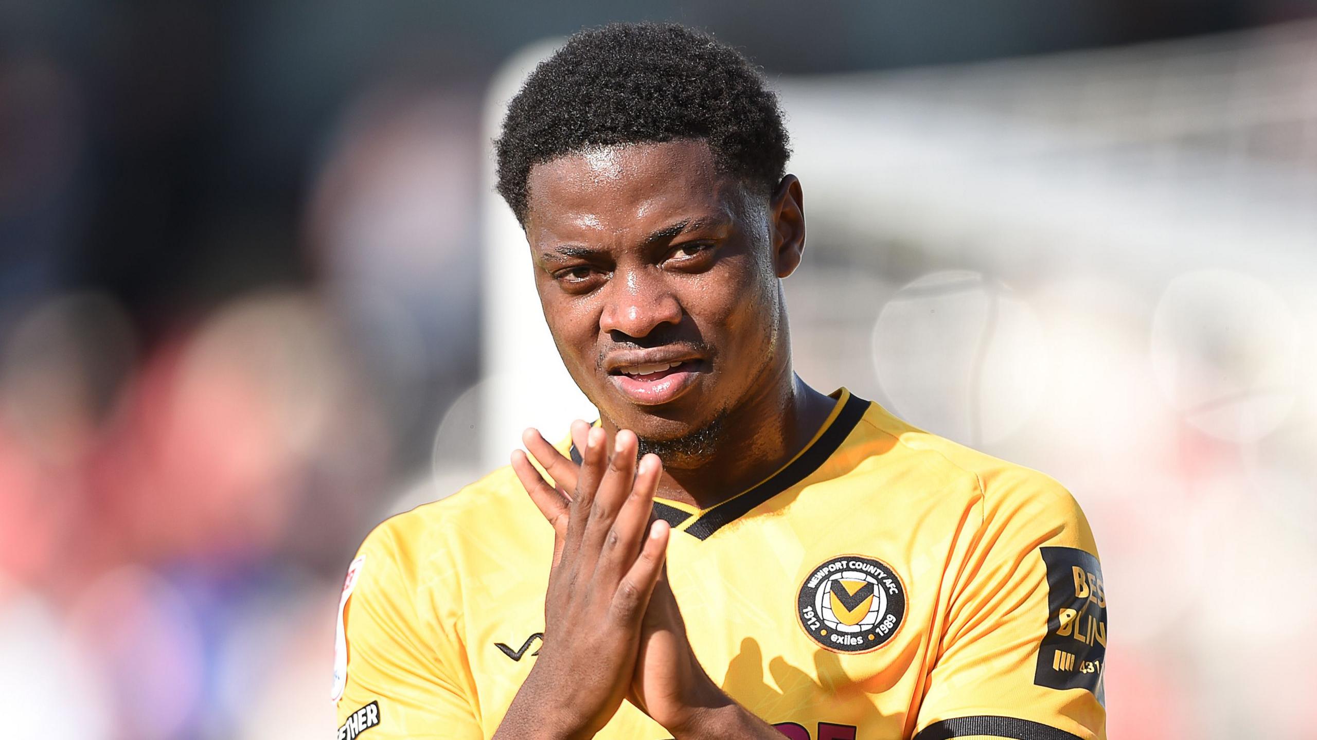 Newport County forward Bobby Kamwa applauds