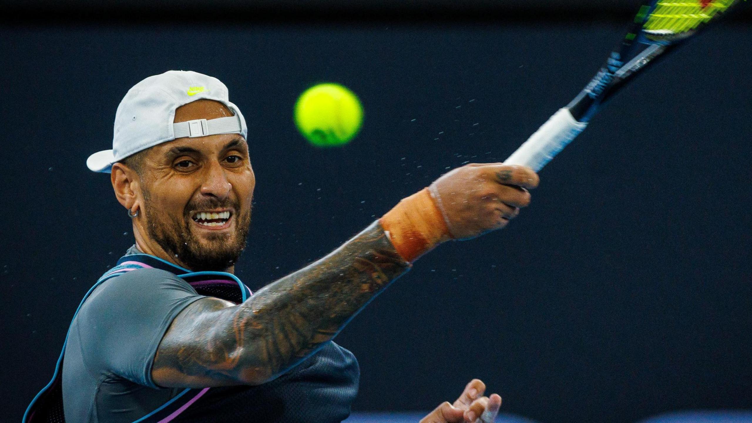 Nick Kyrgios hits a backhand return at the Brisbane International