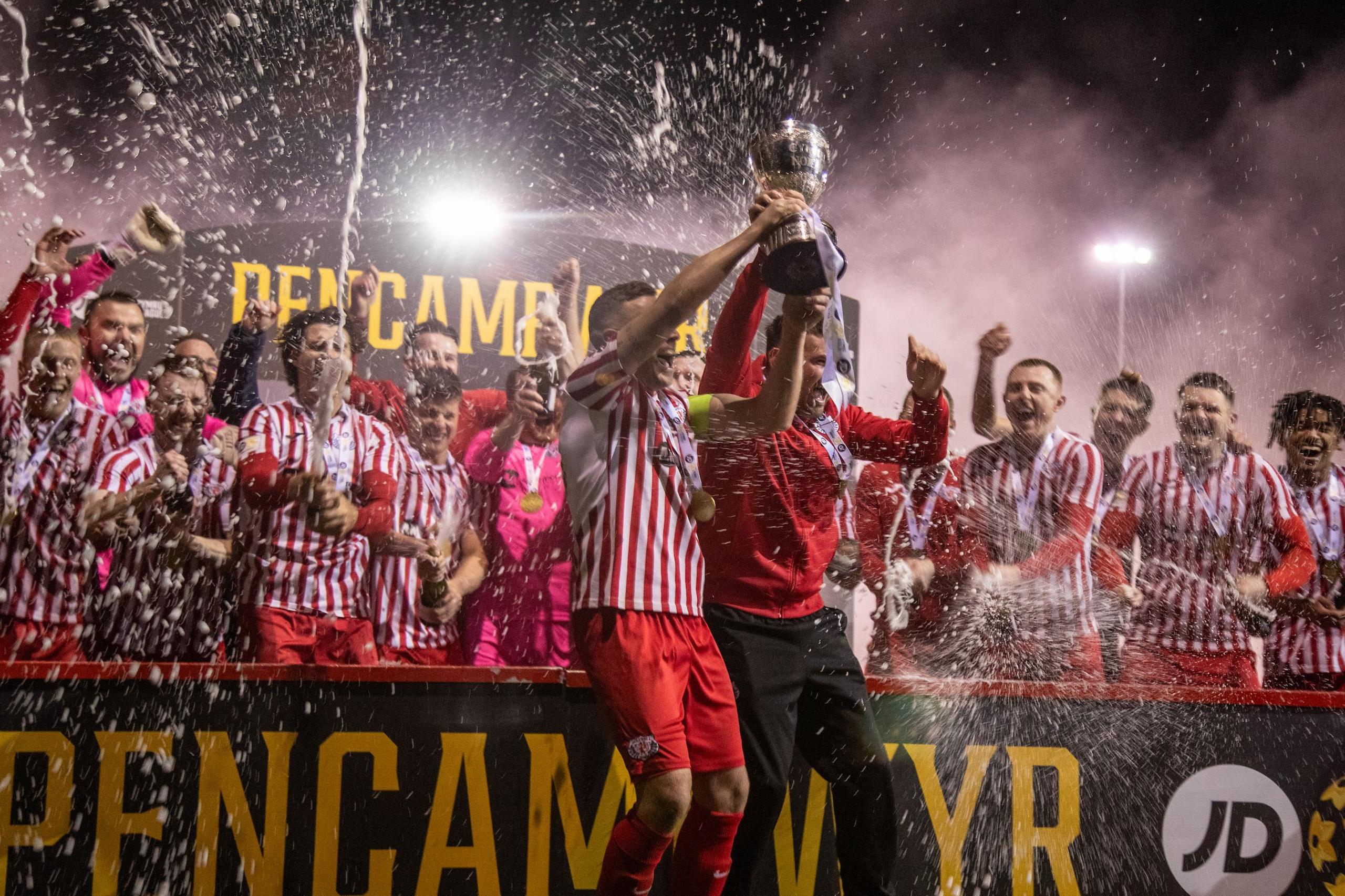 Holywell players celebrate winning the Cymru North