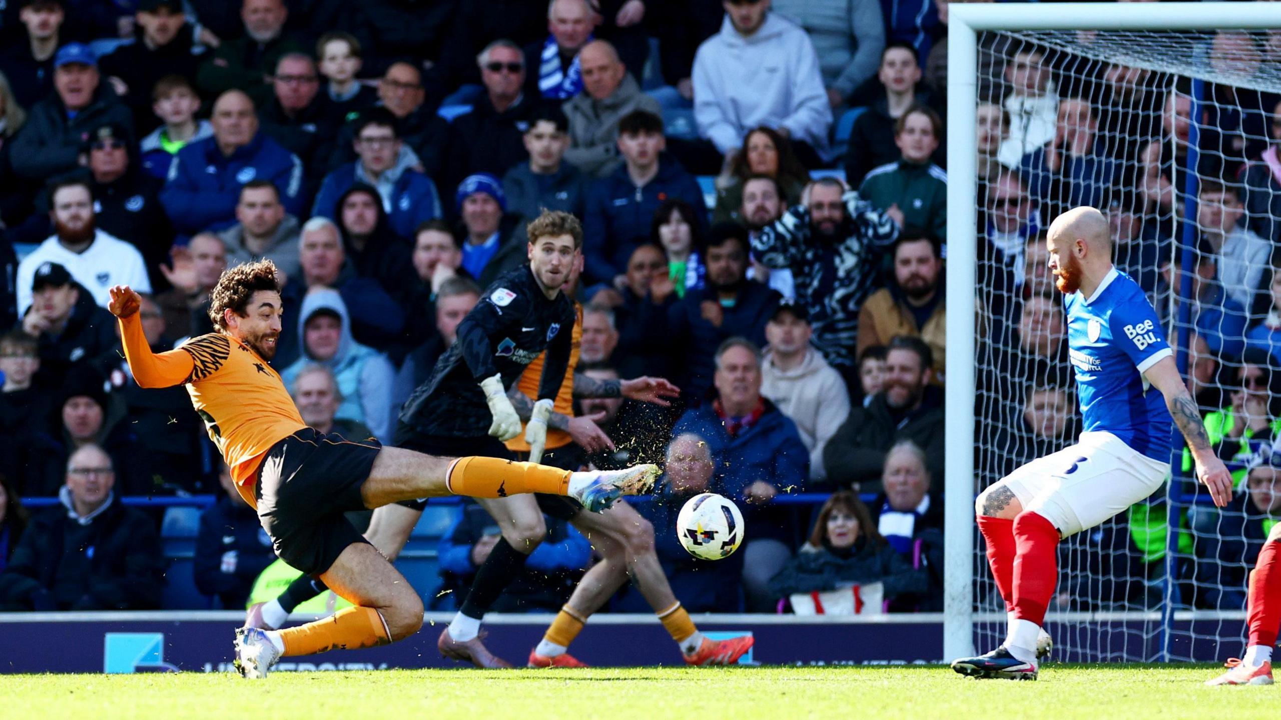 Matt Crooks of Hull City scores a goal against Portsmouth at Fratton Park.