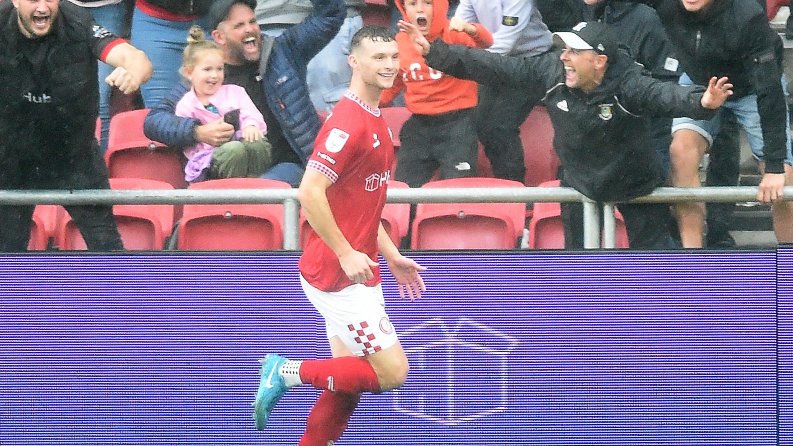 Bristol City centre-back Luke McNally celebrates after scoring a header against Cardiff City