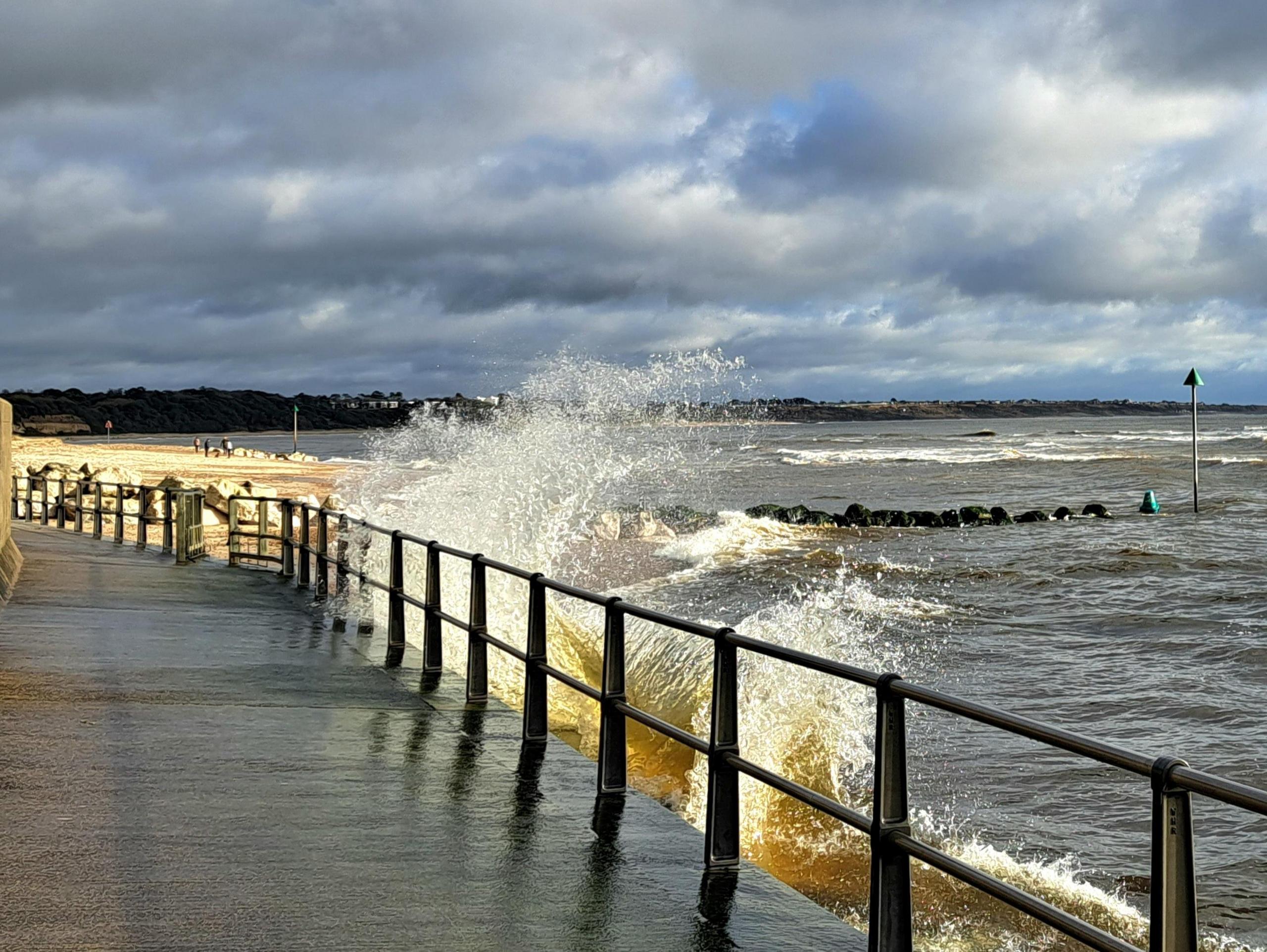 This dramatic shot of the waves crashing against the promenade in Mudeford was caught on camera by MarkieB