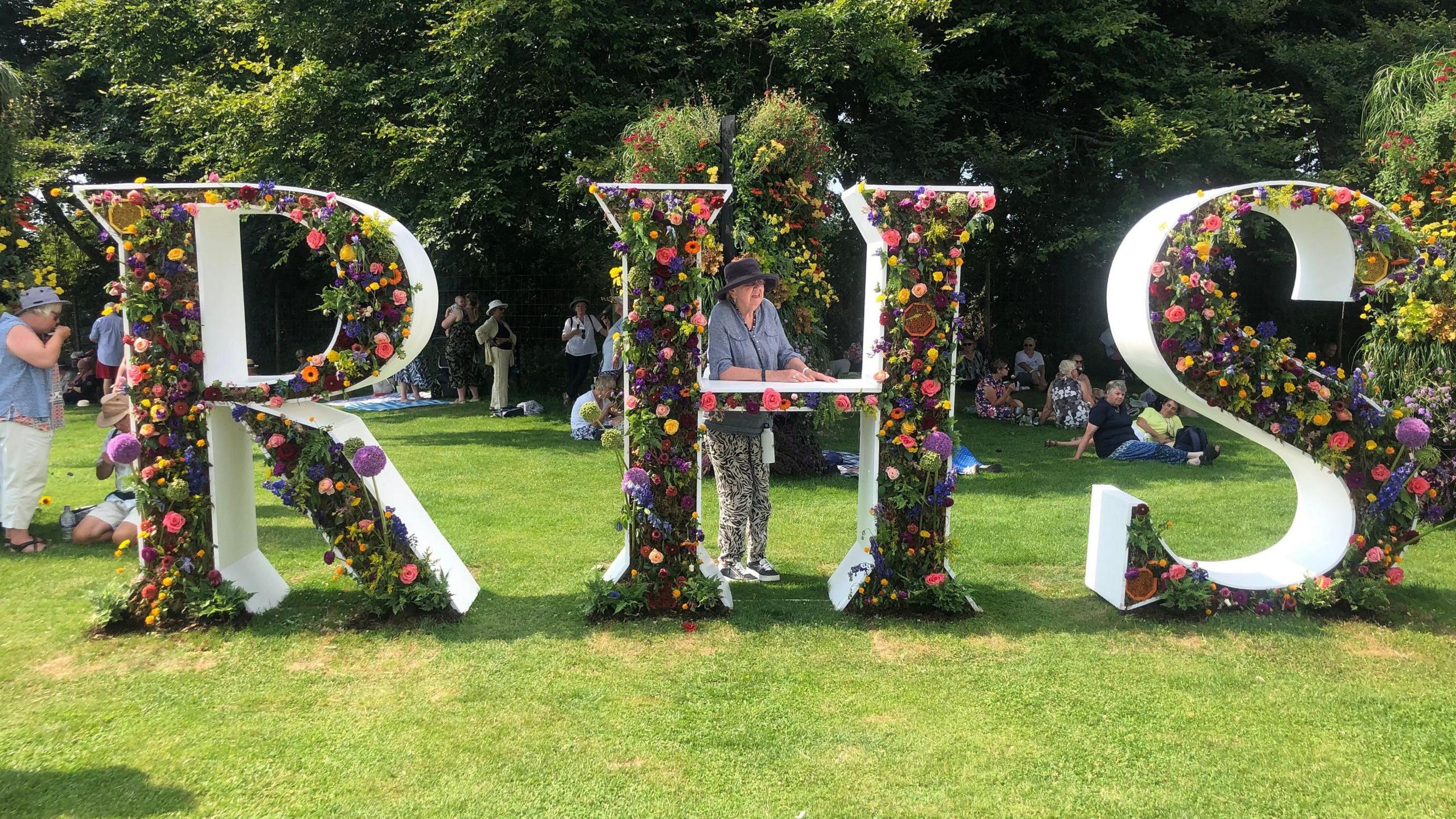 A floral display showing the letters R, H, S at one of the Royal Horticultural Society's shows.