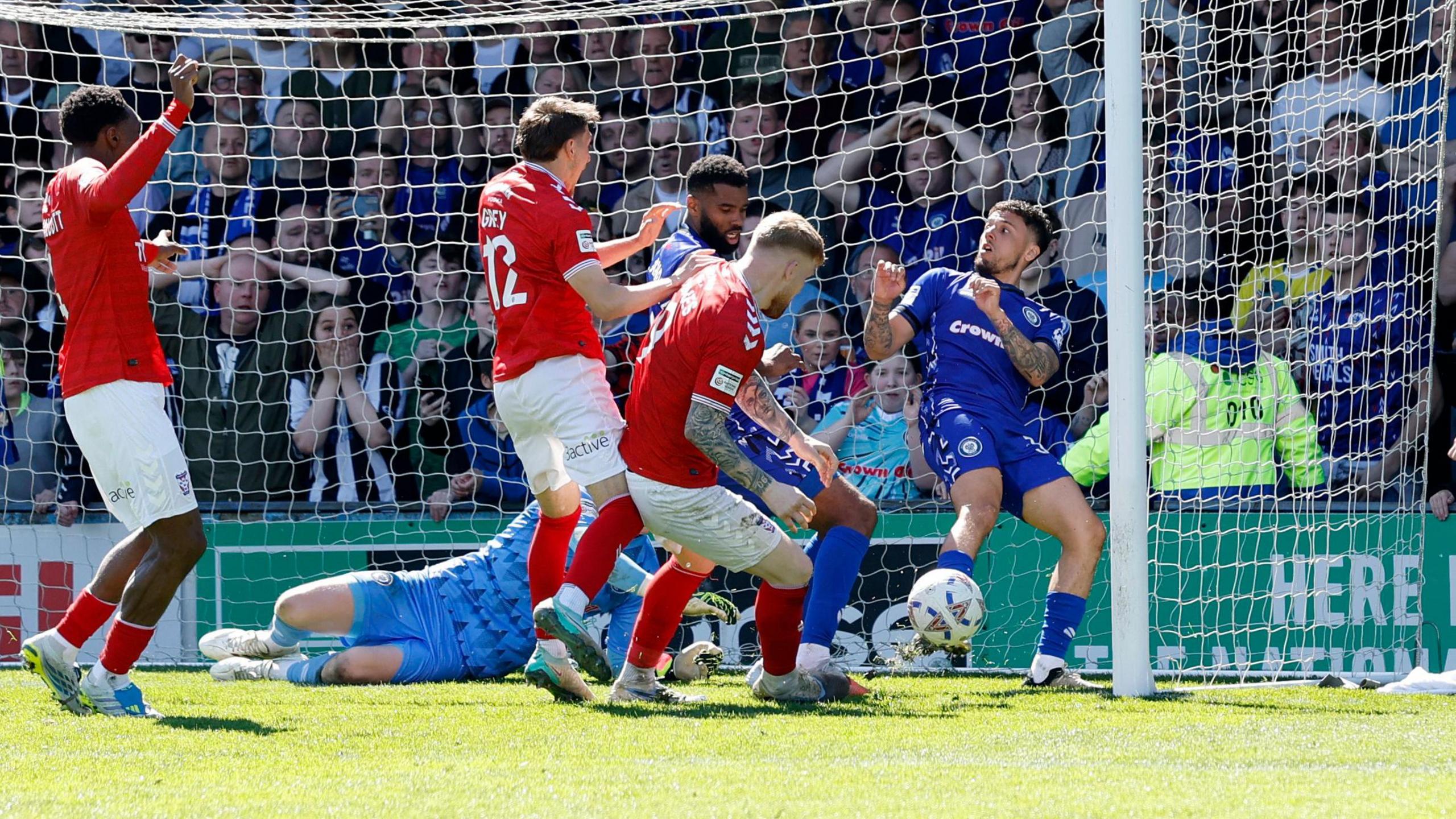 Josh Stones taps in the title-deciding goal at Rochdale