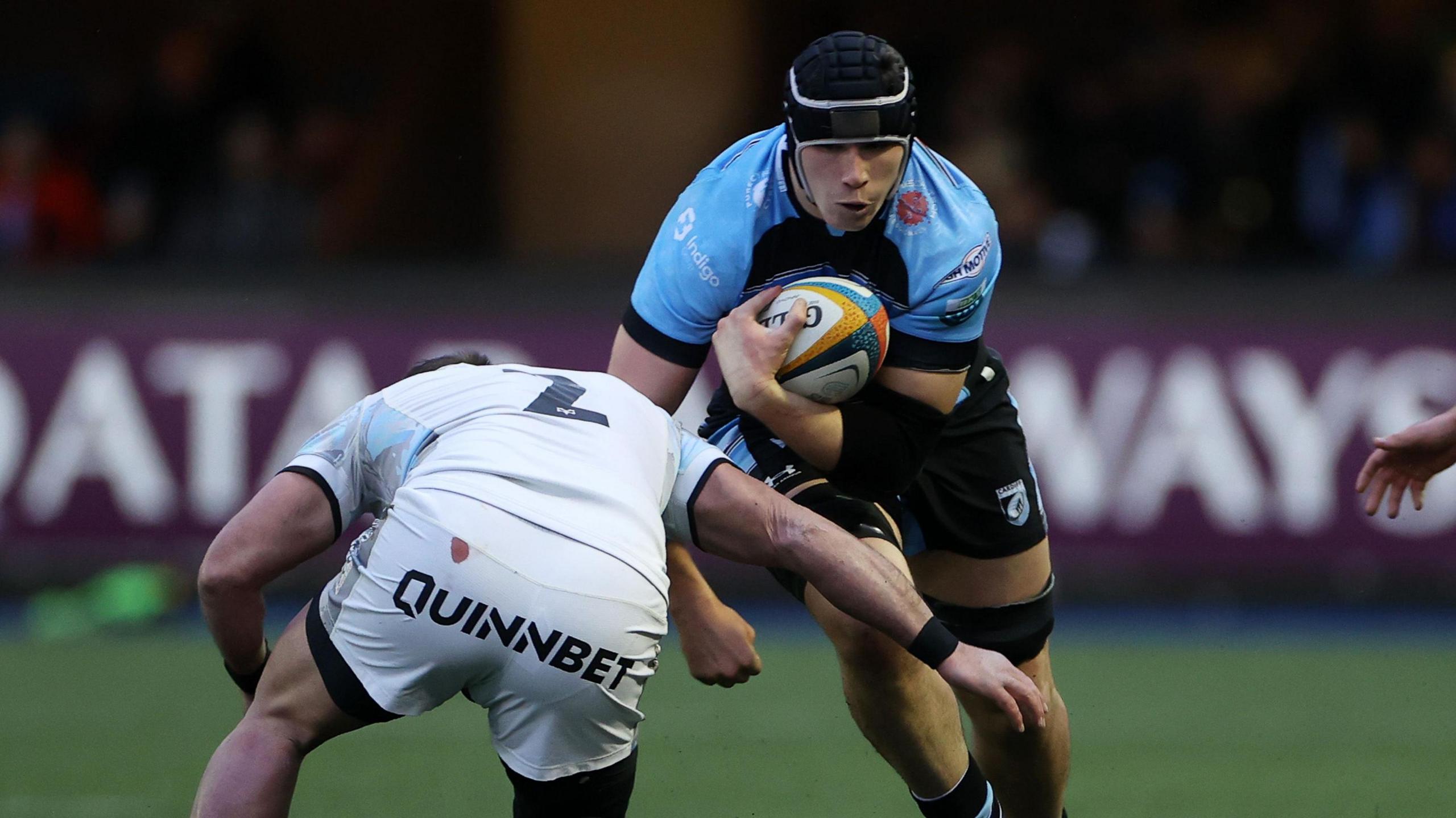 Seb Davies is tackled by fellow Wales international Sam Parry