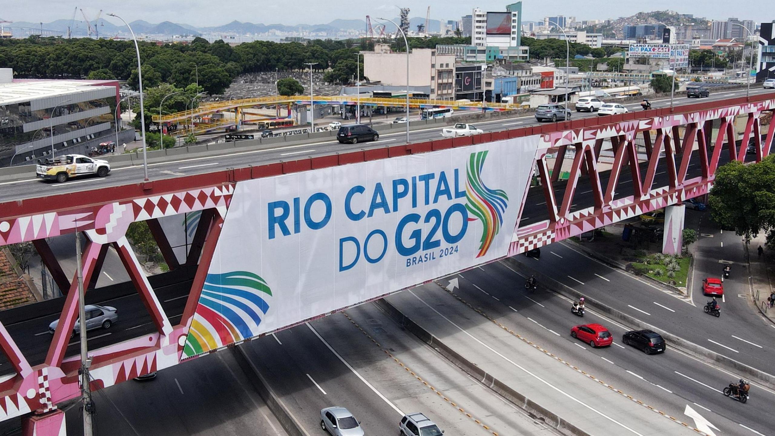 A bridge in Rio shows a large poster advertising the G20 summit. 