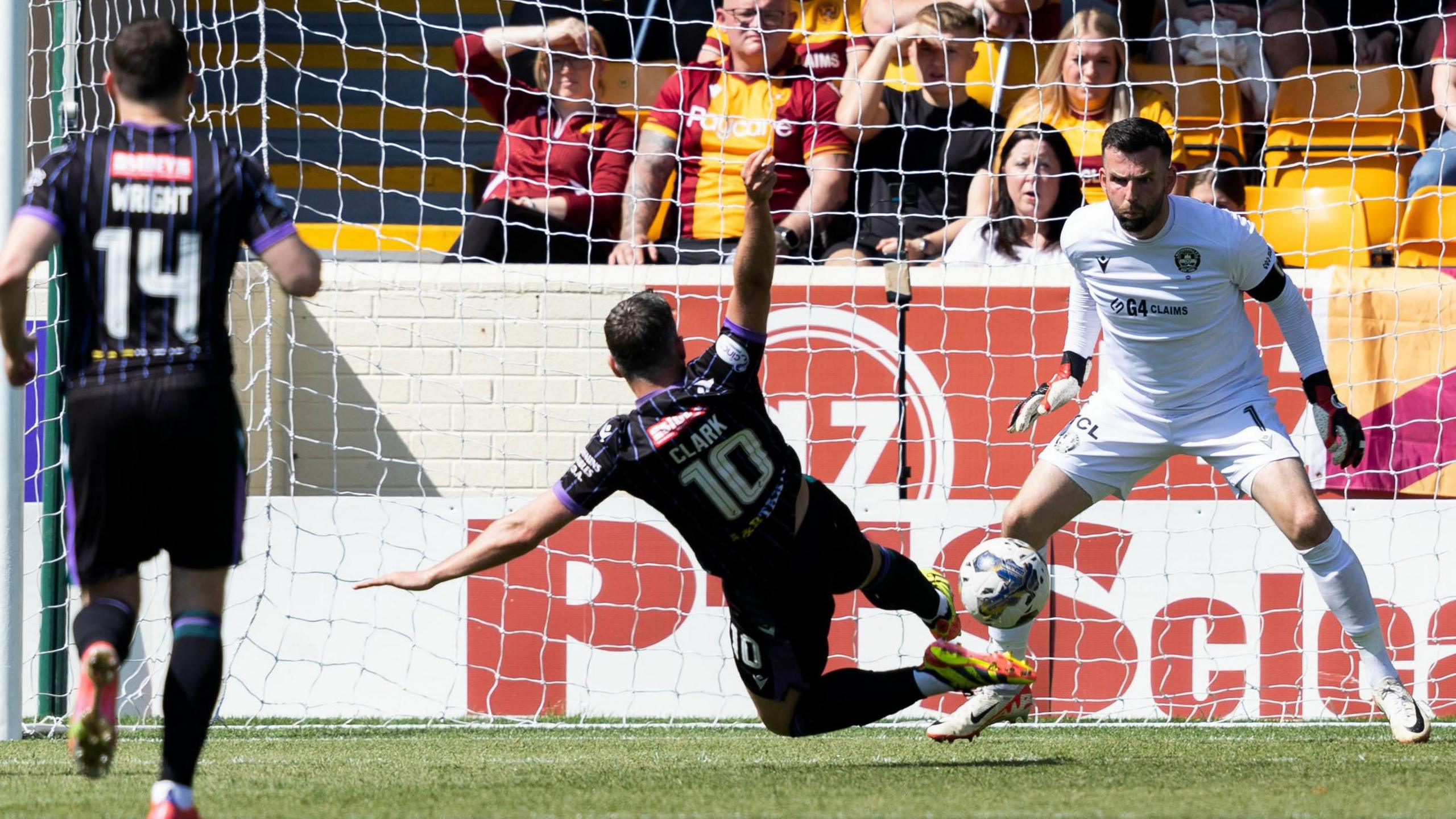 Nicky Clark stretches to put St Johnstone in front against Motherwell at Fir Park