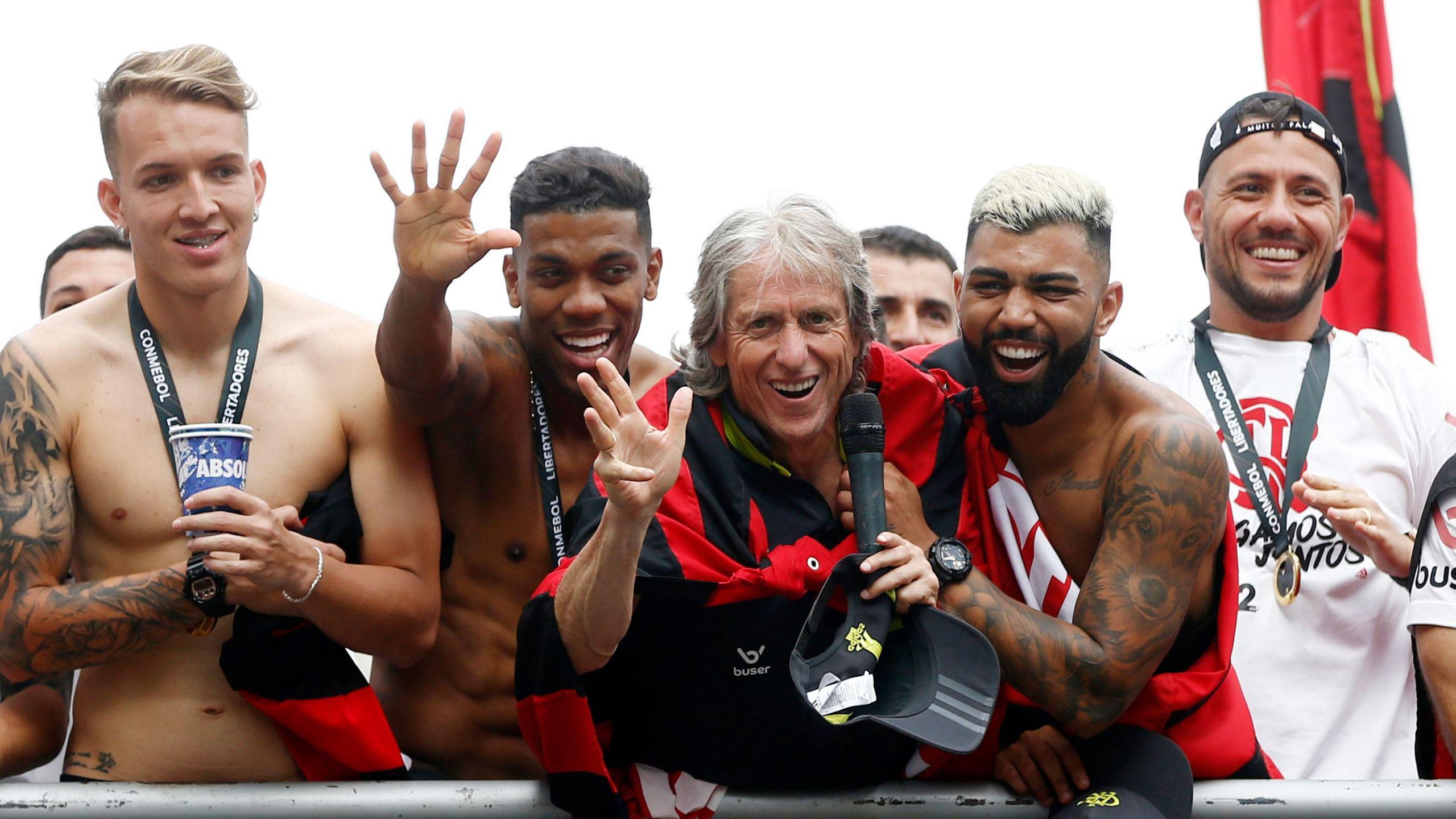 Flamengo manager Jorge Jesus on an open-top bus with his squad of players celebrating winning the Copa Libertadores in 2019