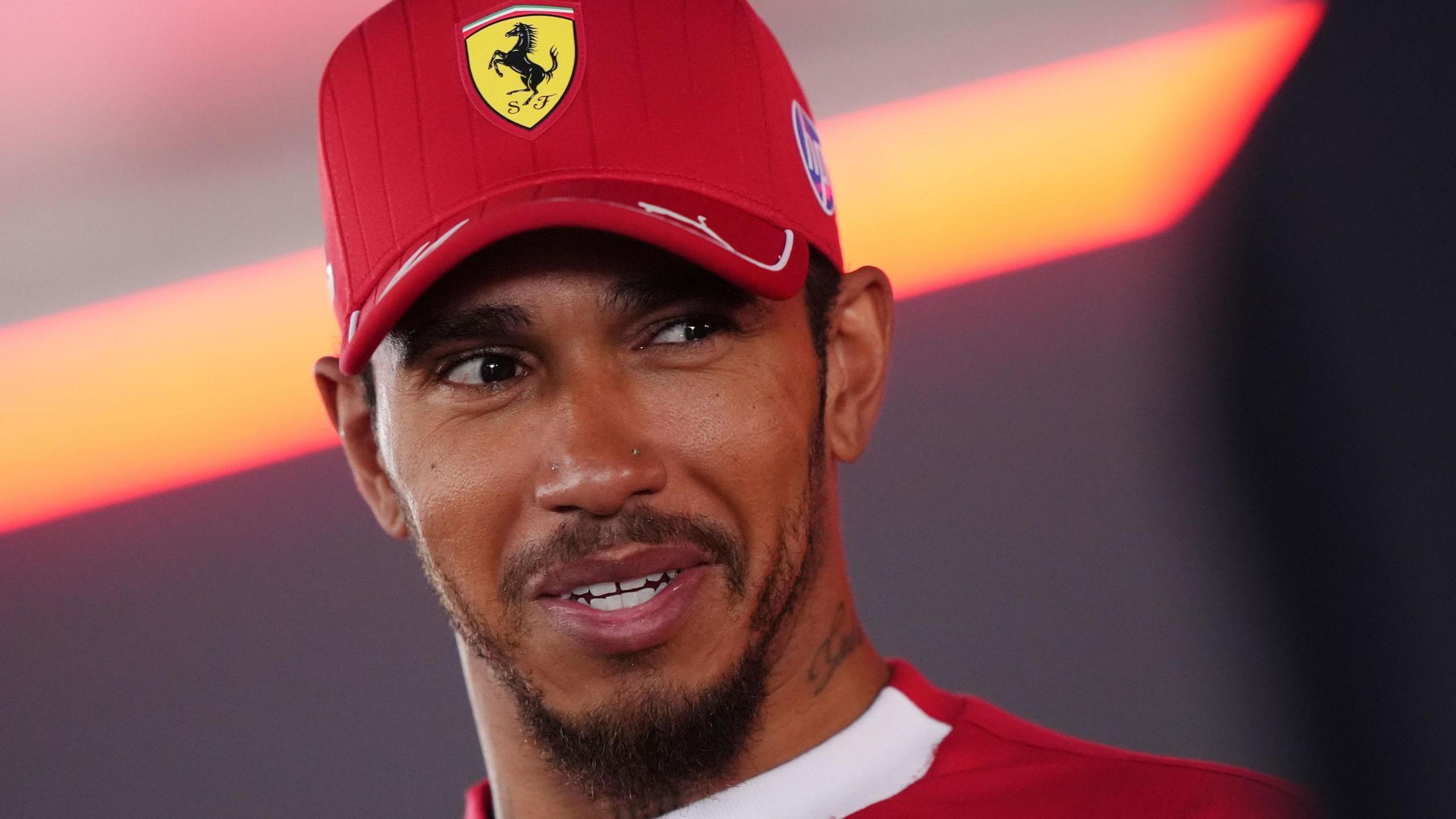 Lewis Hamilton smiling while being interviewed after the Dutch Grand Prix qualifying