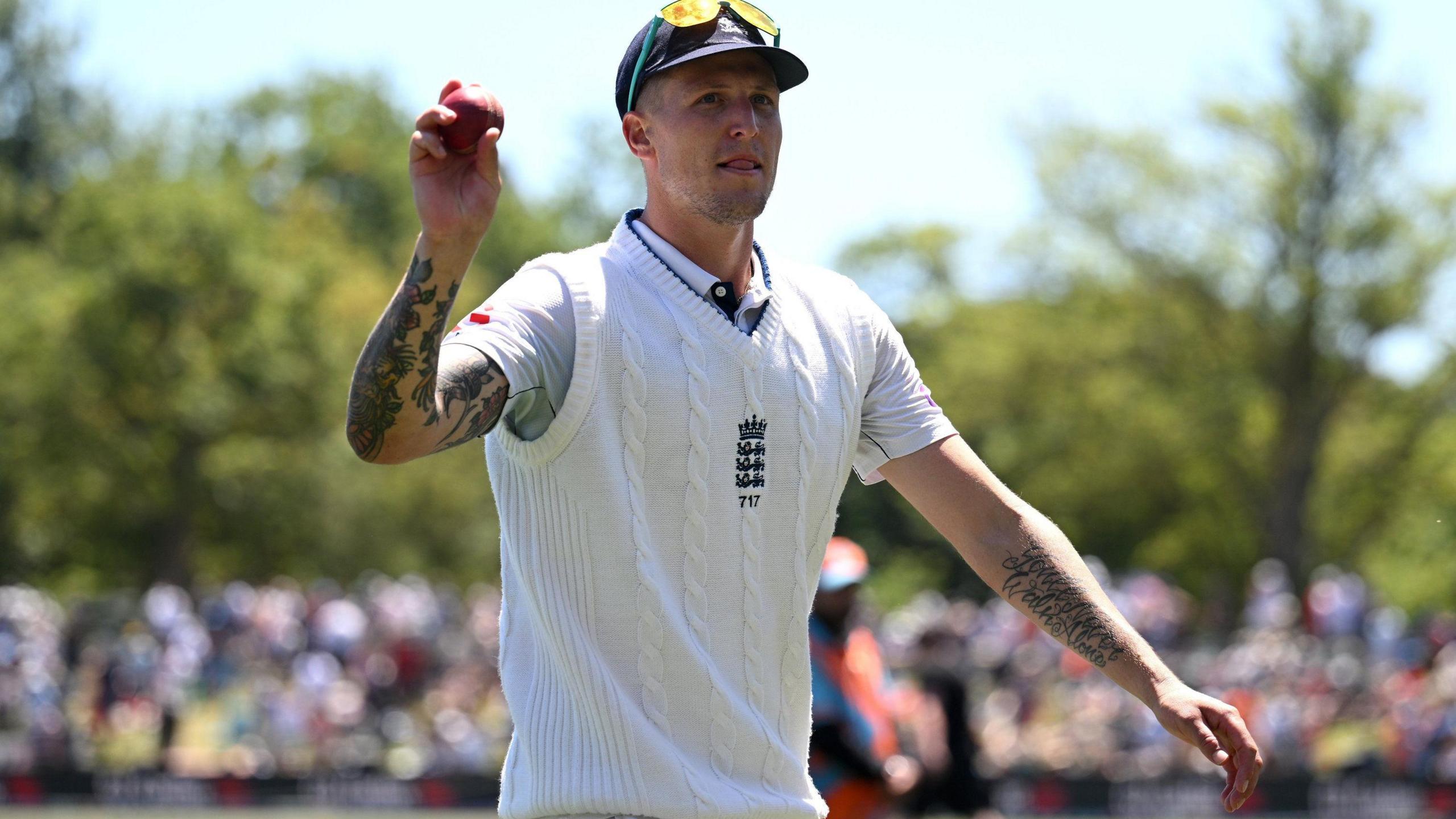 Brydon Carse holds up the ball after taking six wickets in the second innings against New Zealand