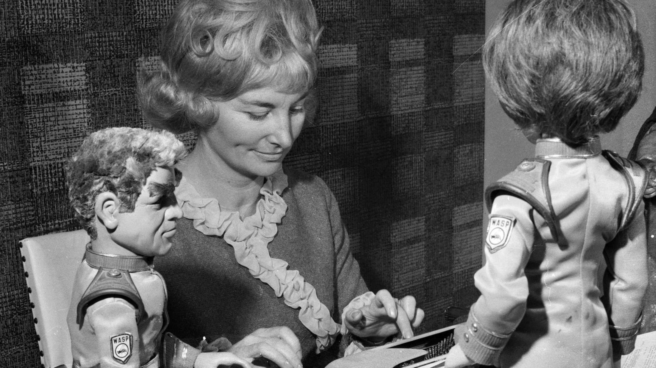 1964: Sylvia Anderson, co-director of AP Studios and designer of the puppets used in the TV adventure series 'Stingray', with two characters from the series 'Commander Shore and Atlanta'. 