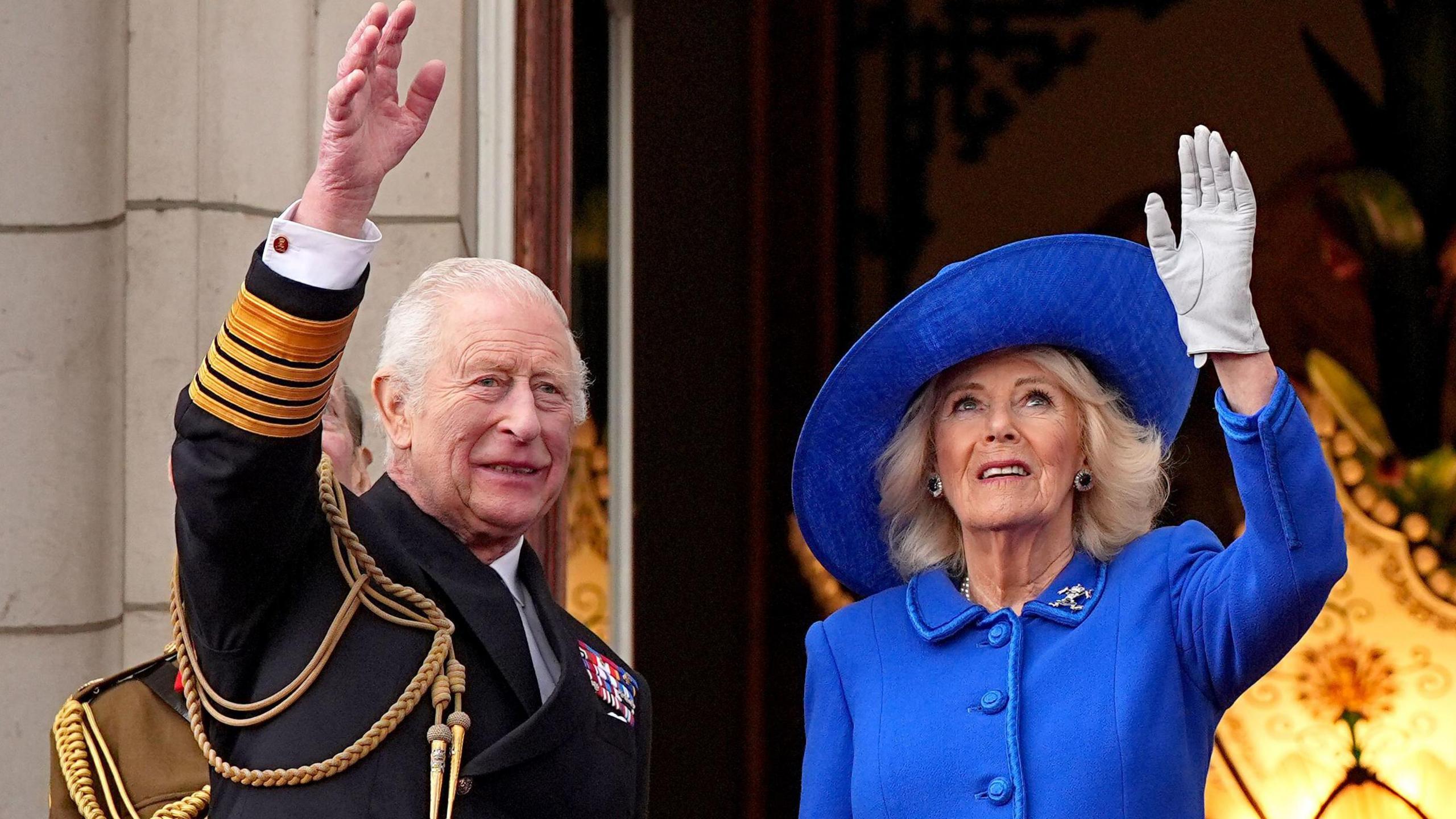 King Charles and Queen Camilla waved from the Palace balcony