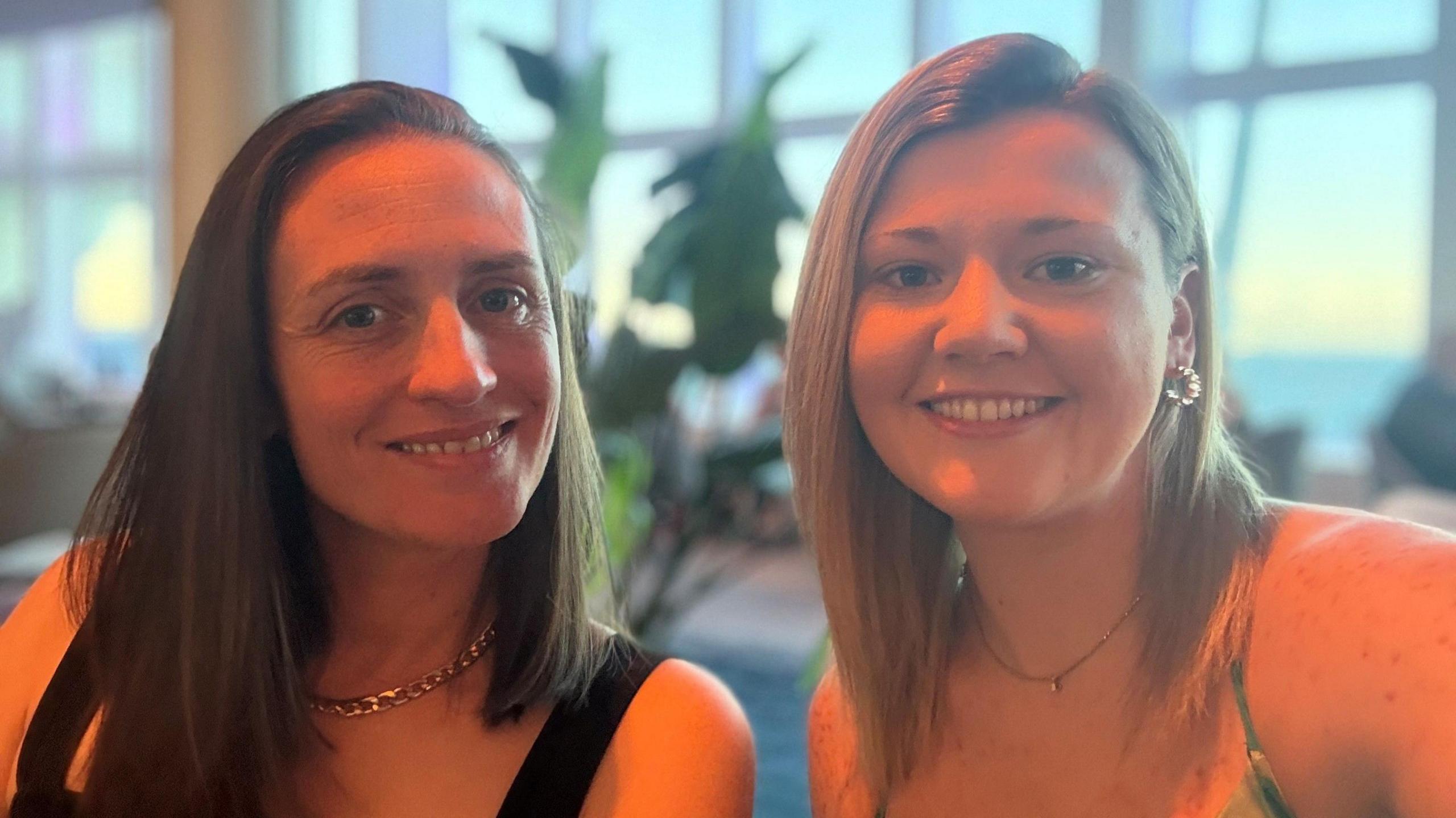 Emma Morgan posing for a photo with her wife Hayley 