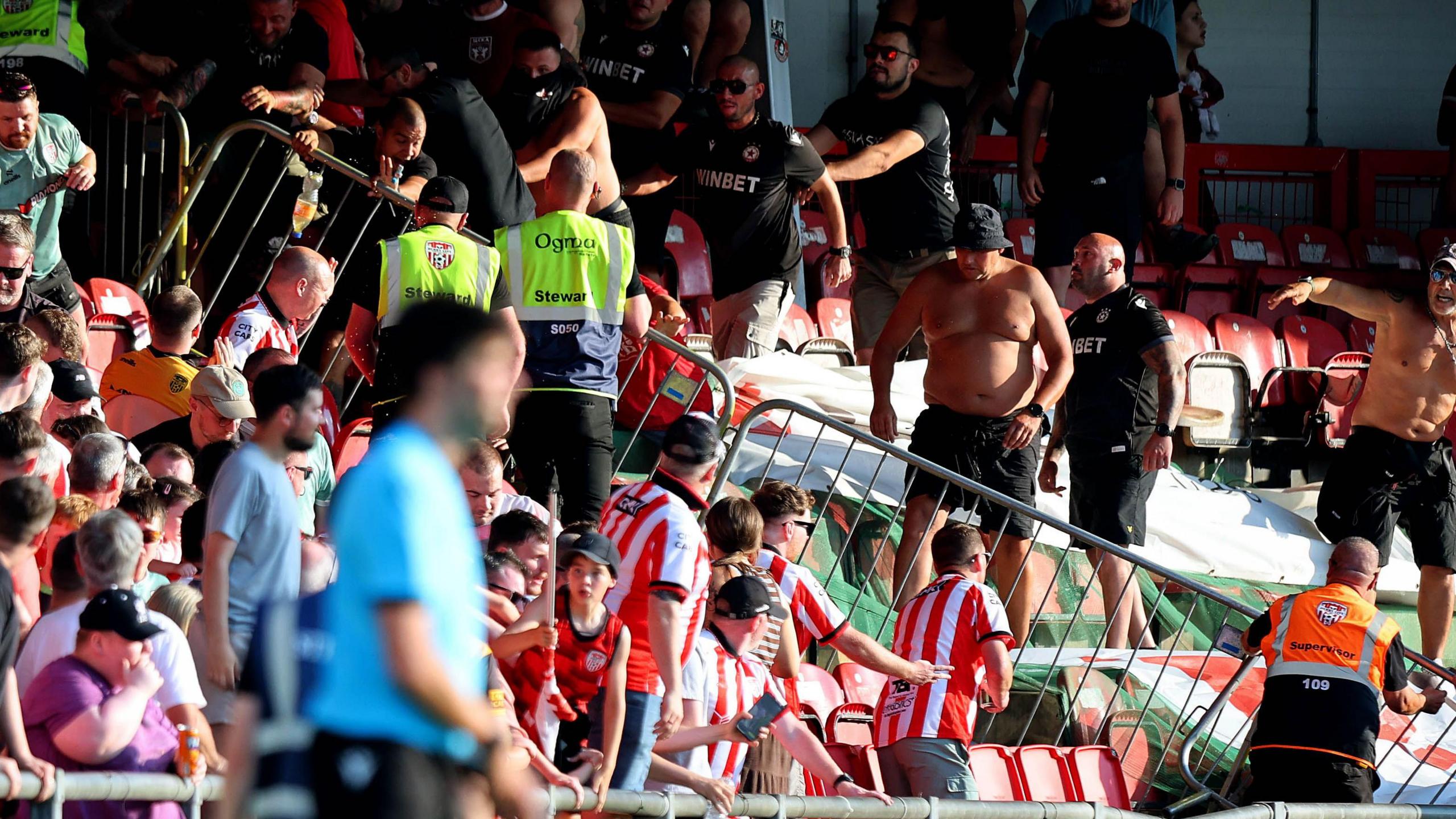 CSKA Sofia fans rush a barrier at the Brandywell