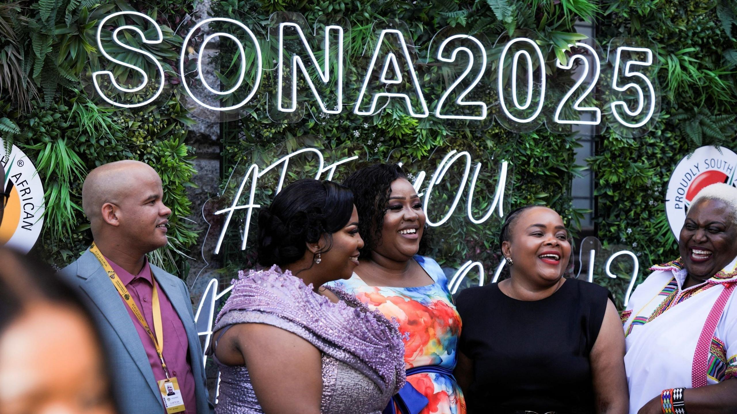 Guests arrive at the State of the Nation Address red carpet and pose for a photograph outside at the City Hall in Cape Town, South Africa.