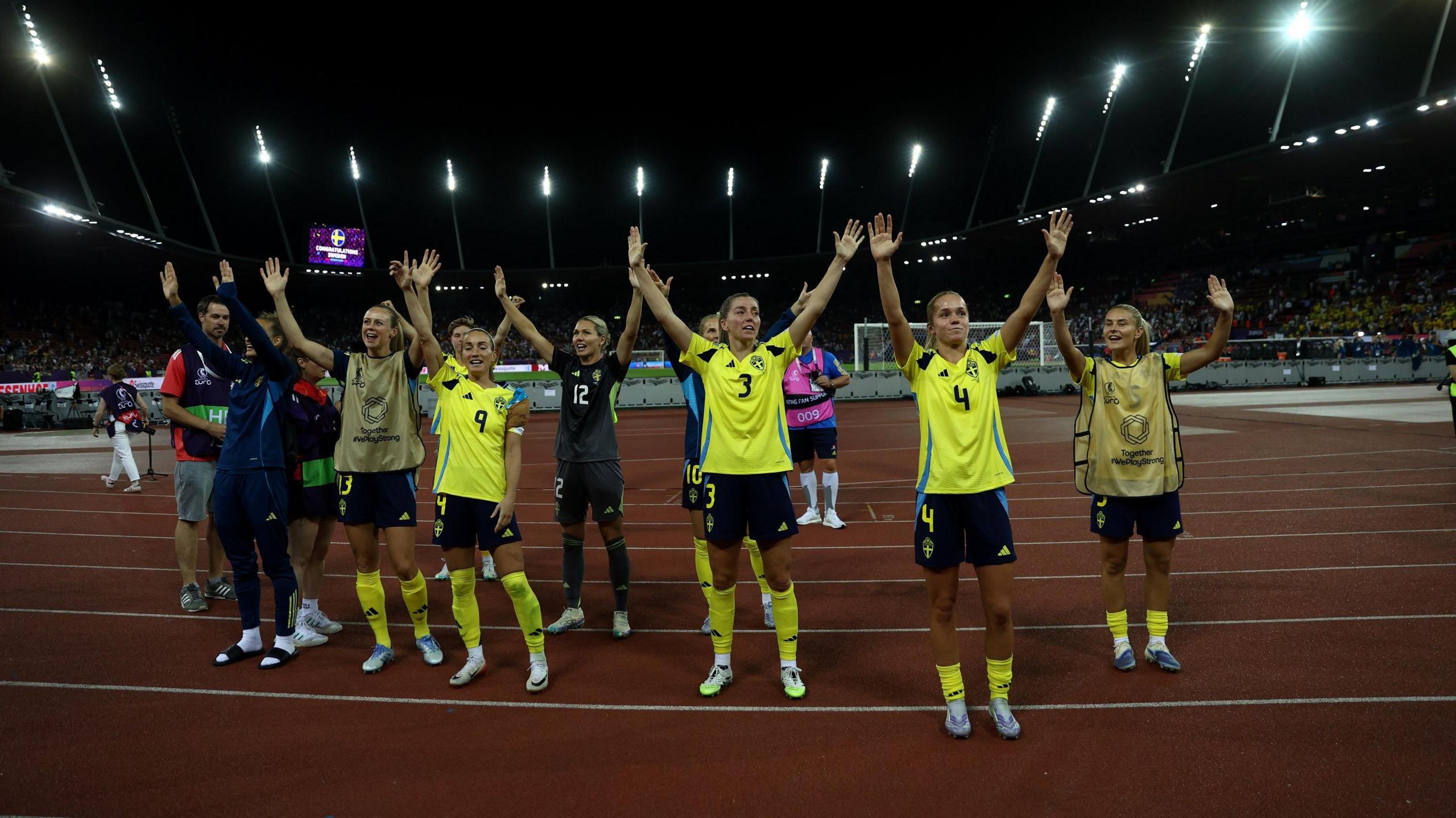 Sweden celebrate with supporter