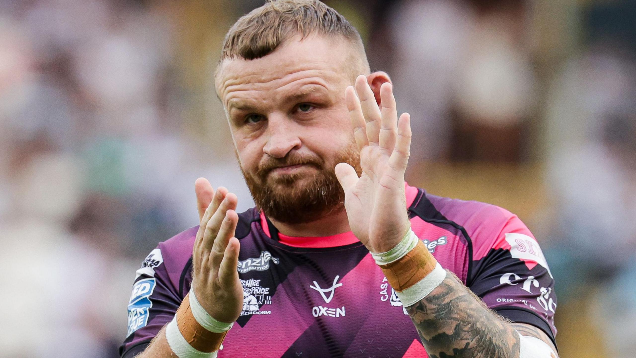 Brad Singleton applauds the Castleford Tigers fans after a match
