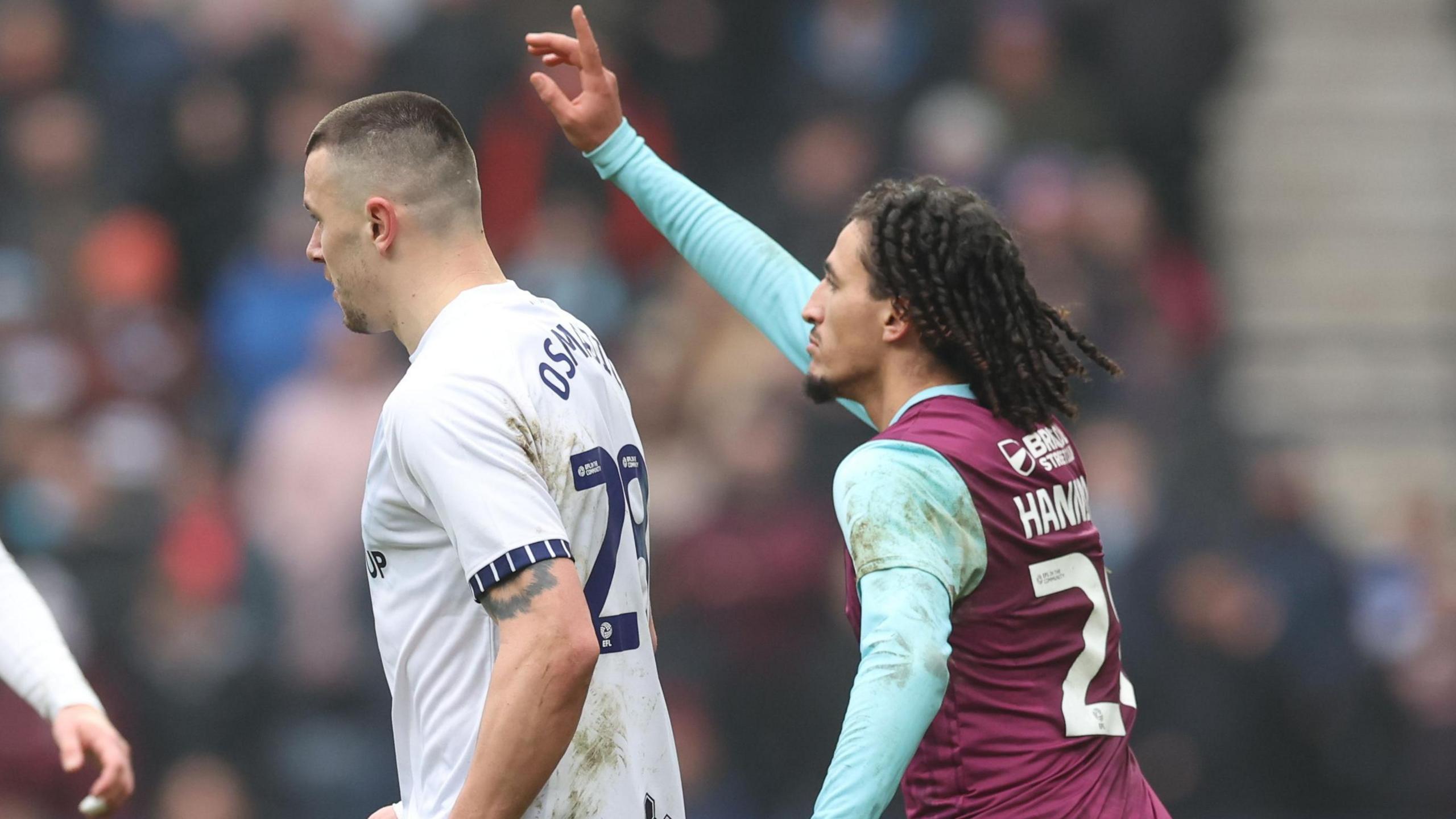 Hannibal Mejbri tries to get the attention of the referee after the alleged incident with Milutin Osmajic in February