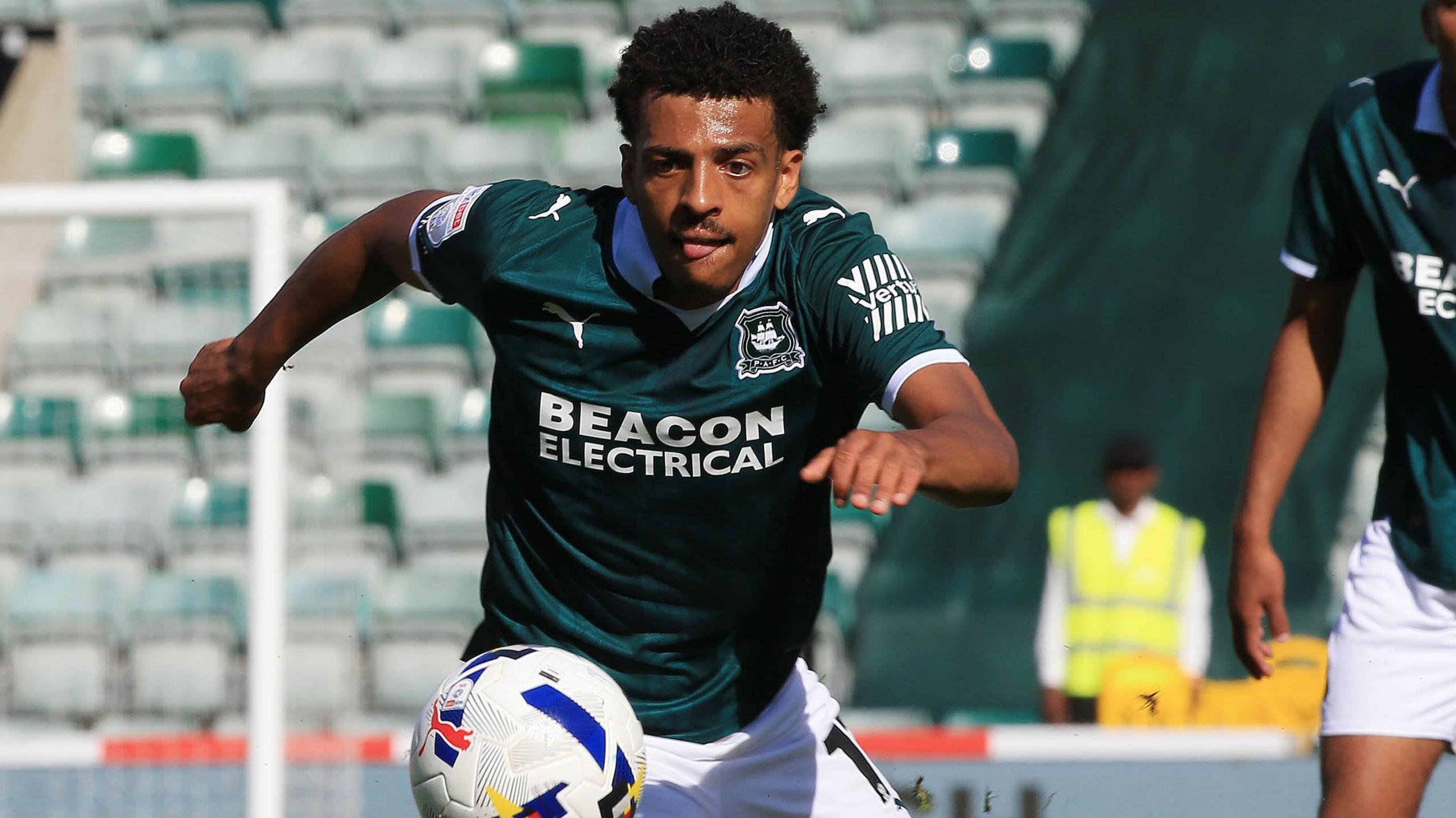 Caleb Watts chasing a ball