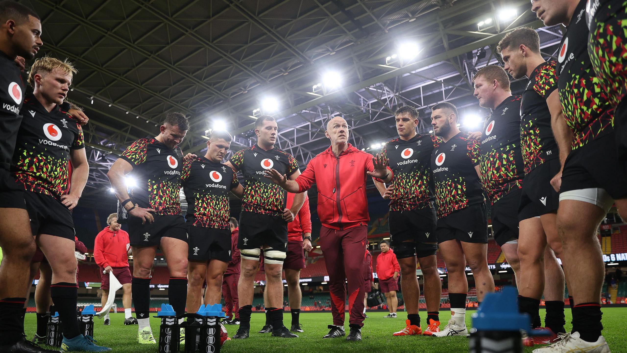 New Wales head coach Steve Tandy in a huddle with his squad