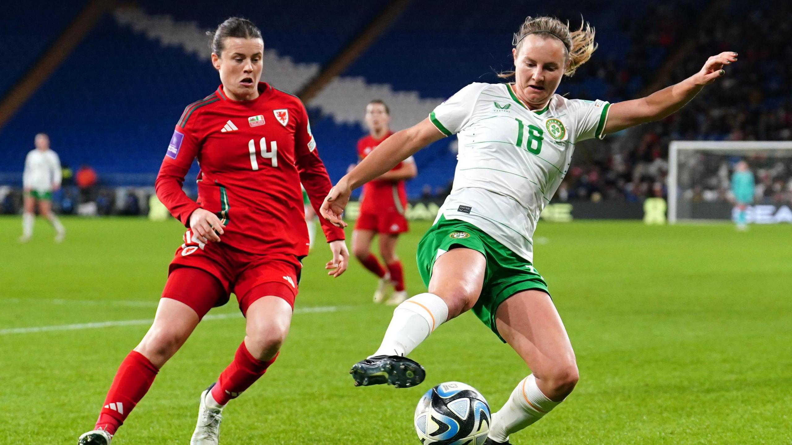 Wales' Hayley Ladd (left) and Republic of Ireland's Kyra Carusa battle for the ball during the first leg of the UEFA Women's Euro 2025 Qualifying play off,