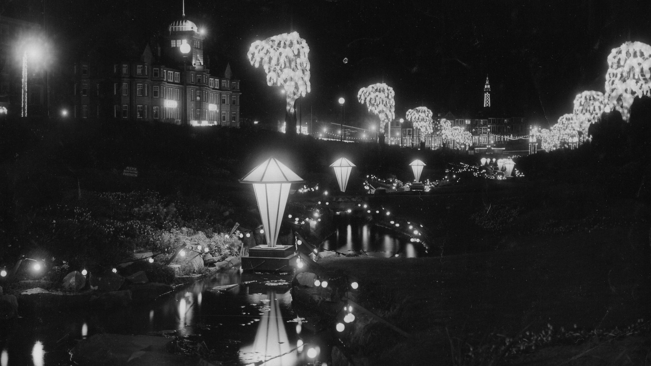 Black-and-white image of the Blackpool Illuminations in Jubilee Gardens in 1952 in the lower garden underneath Queens Promenade.