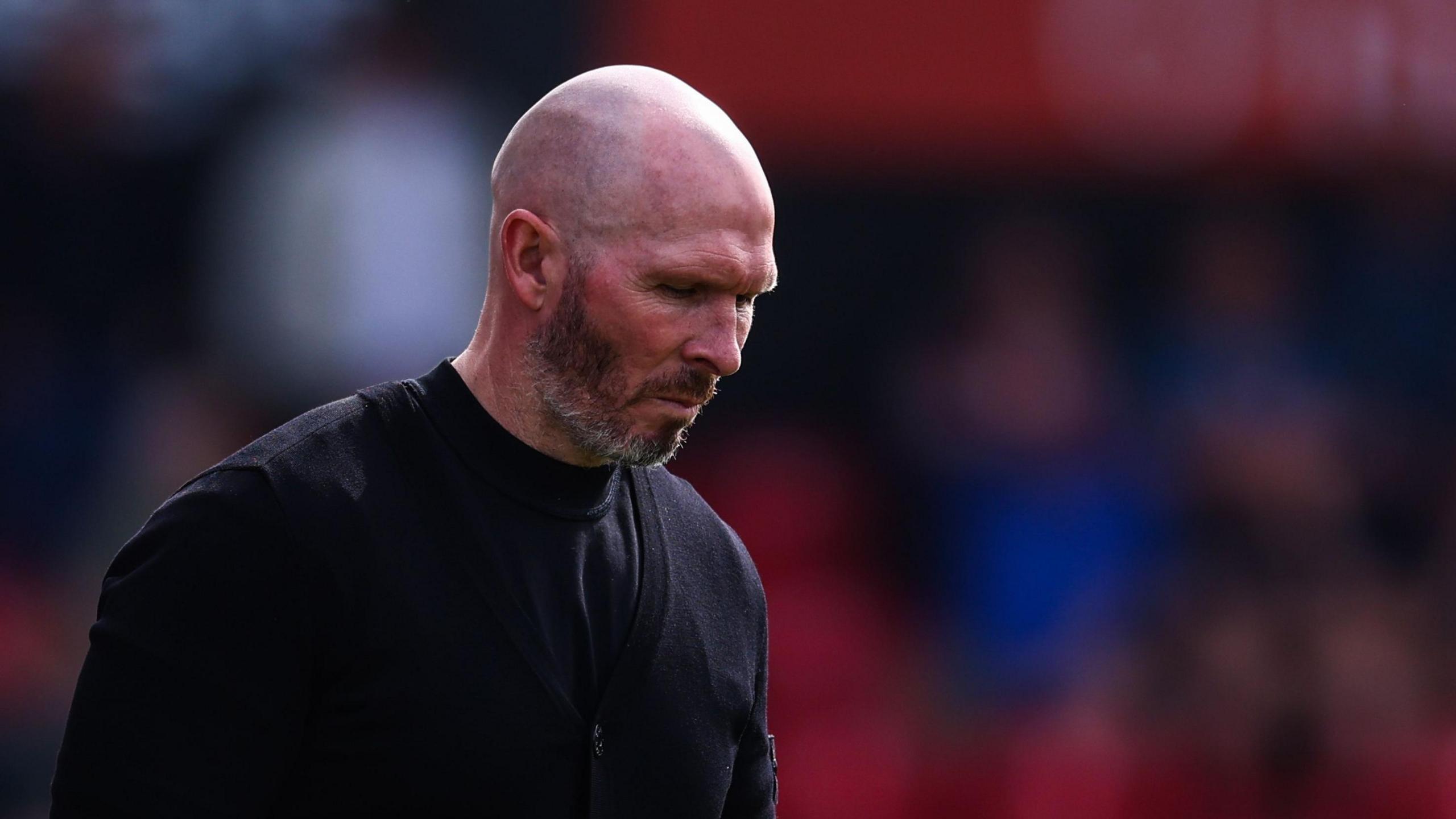 Michael Appleton looks towards the floor during a match.