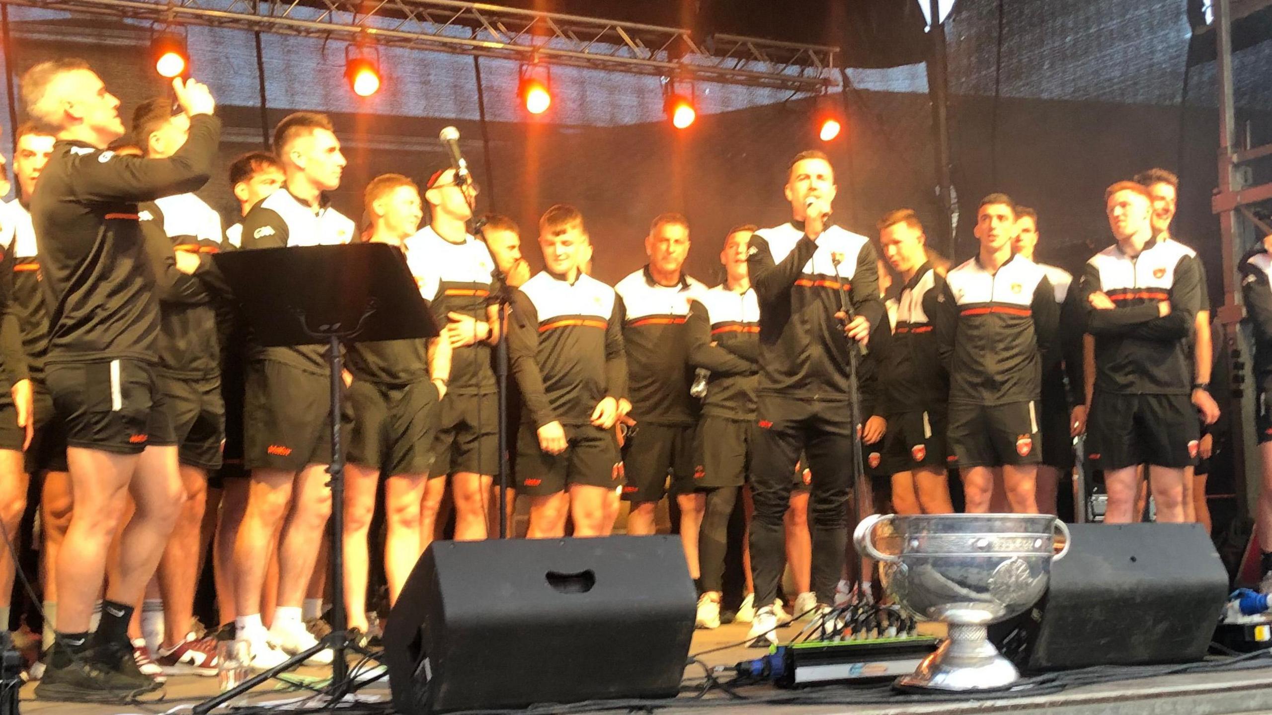 The team on stage with the Sam Maguire cup