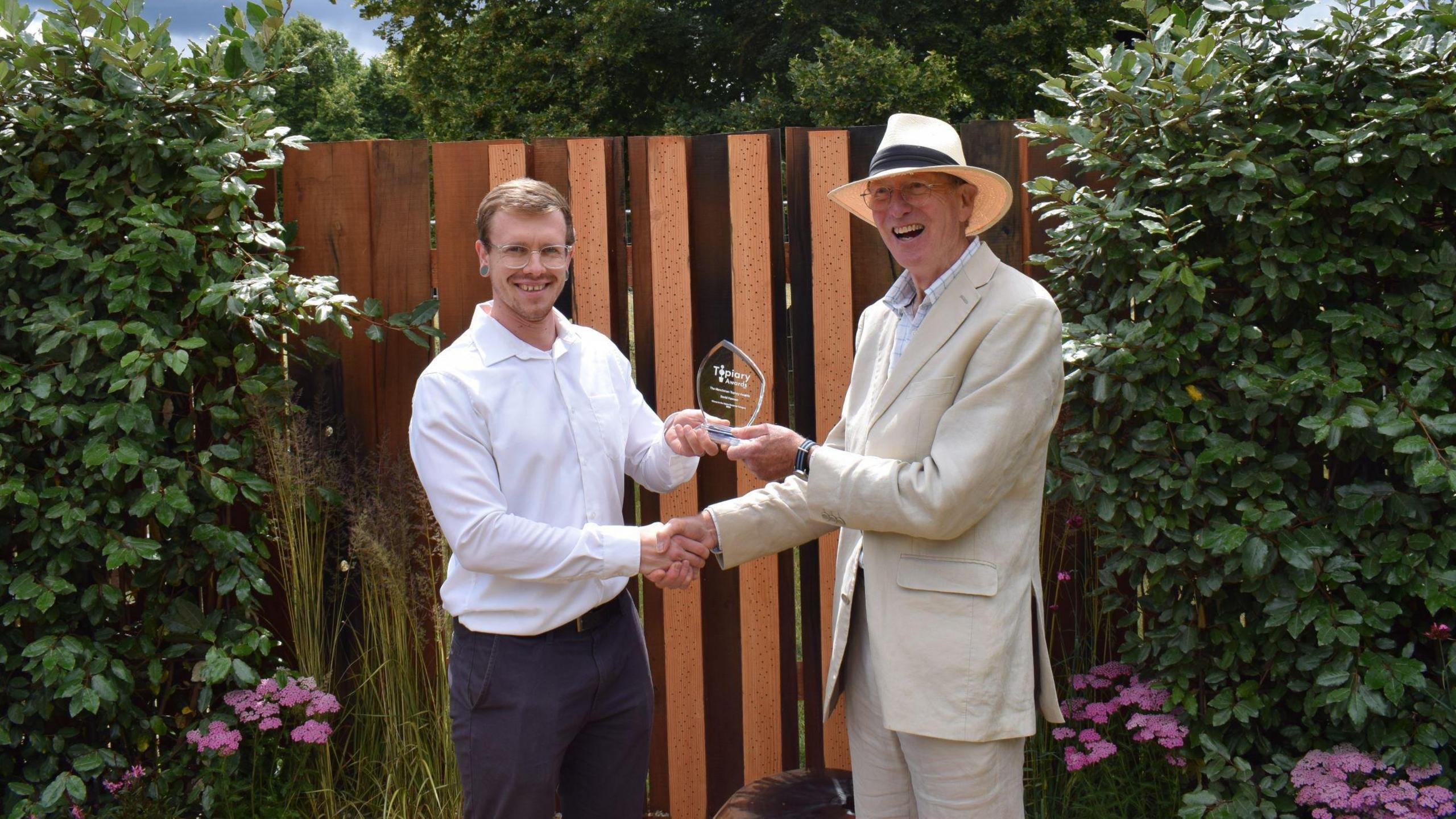 David Hawson accepts his prize from Owen Simpson, managing firector at Henchman