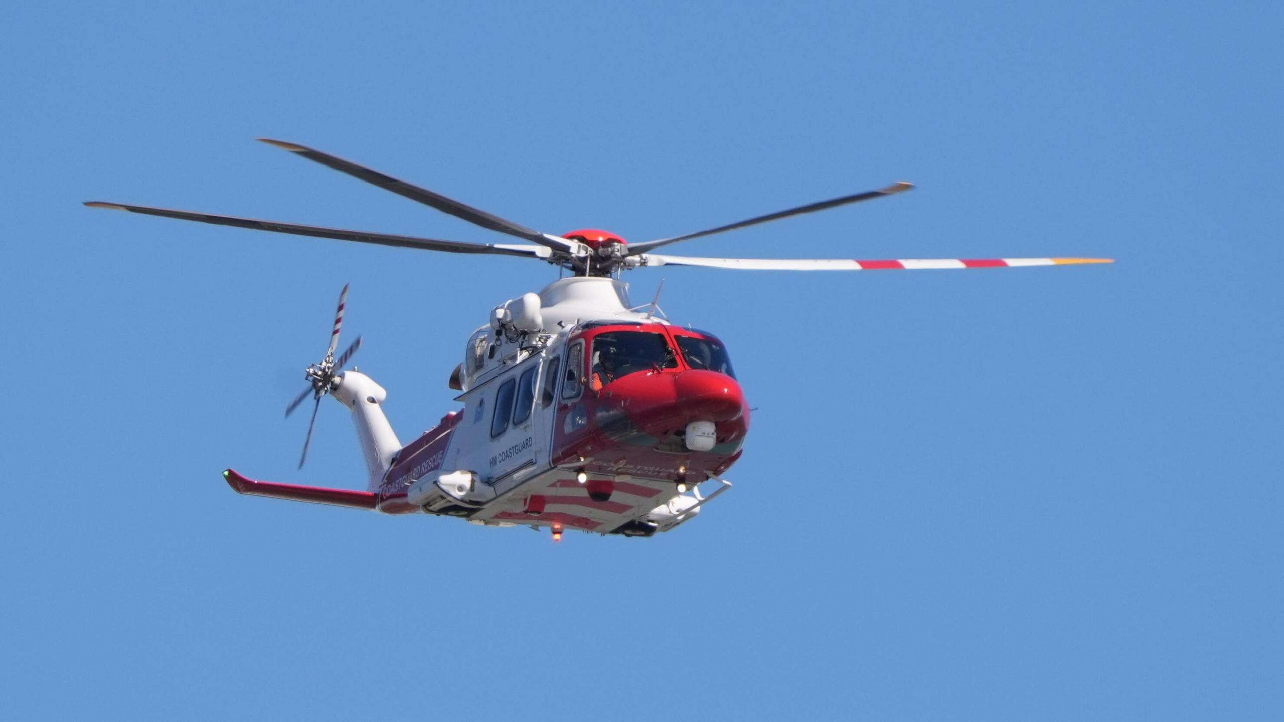 A coastguard emergency helicopter flying above the Port of Dover on Tuesday