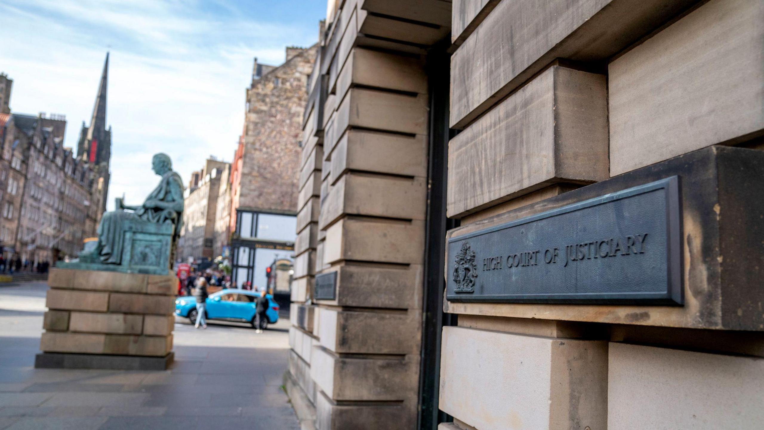 Entrance of the High Court in Edinburgh, with a sign saying High Court of Justiciary