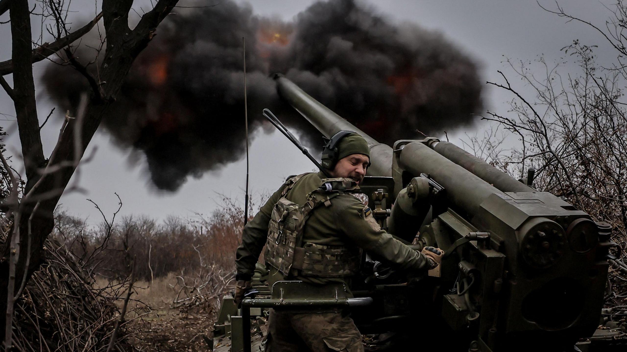 Ukrainian soldier fires a gun near Chasiv Yar