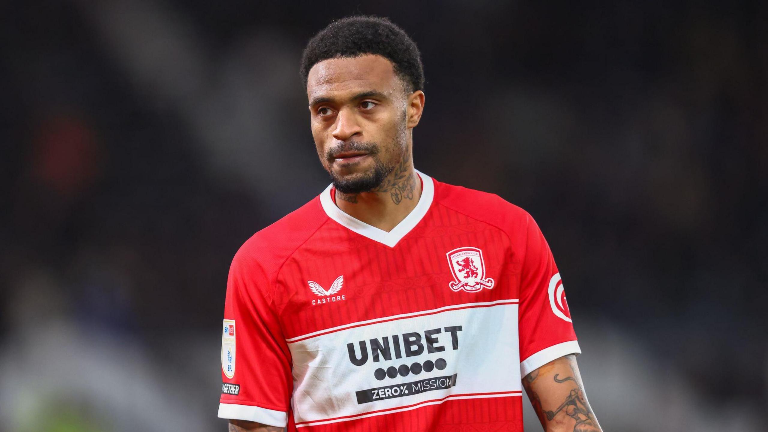 Delano Burgzorg standing on the pitch with his arms by his side during a match for Middlesbrough