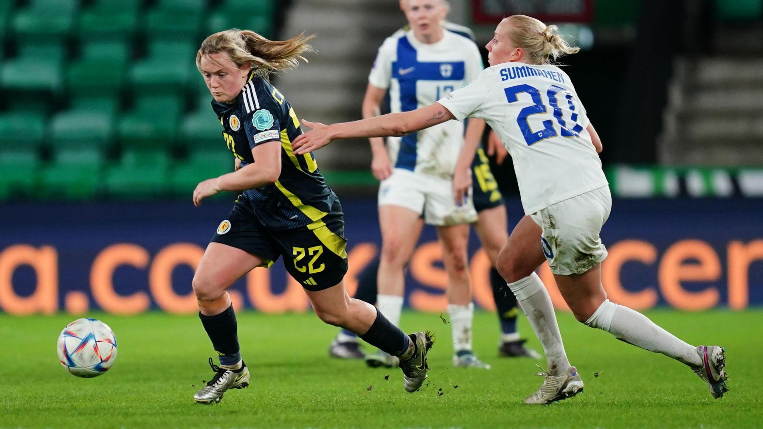 Scotland's Erin Cuthbert (left) and Finland's Eveliina Summanen battle for the ball during the first leg of the UEFA Women's Euro 2025 Qualifying play off