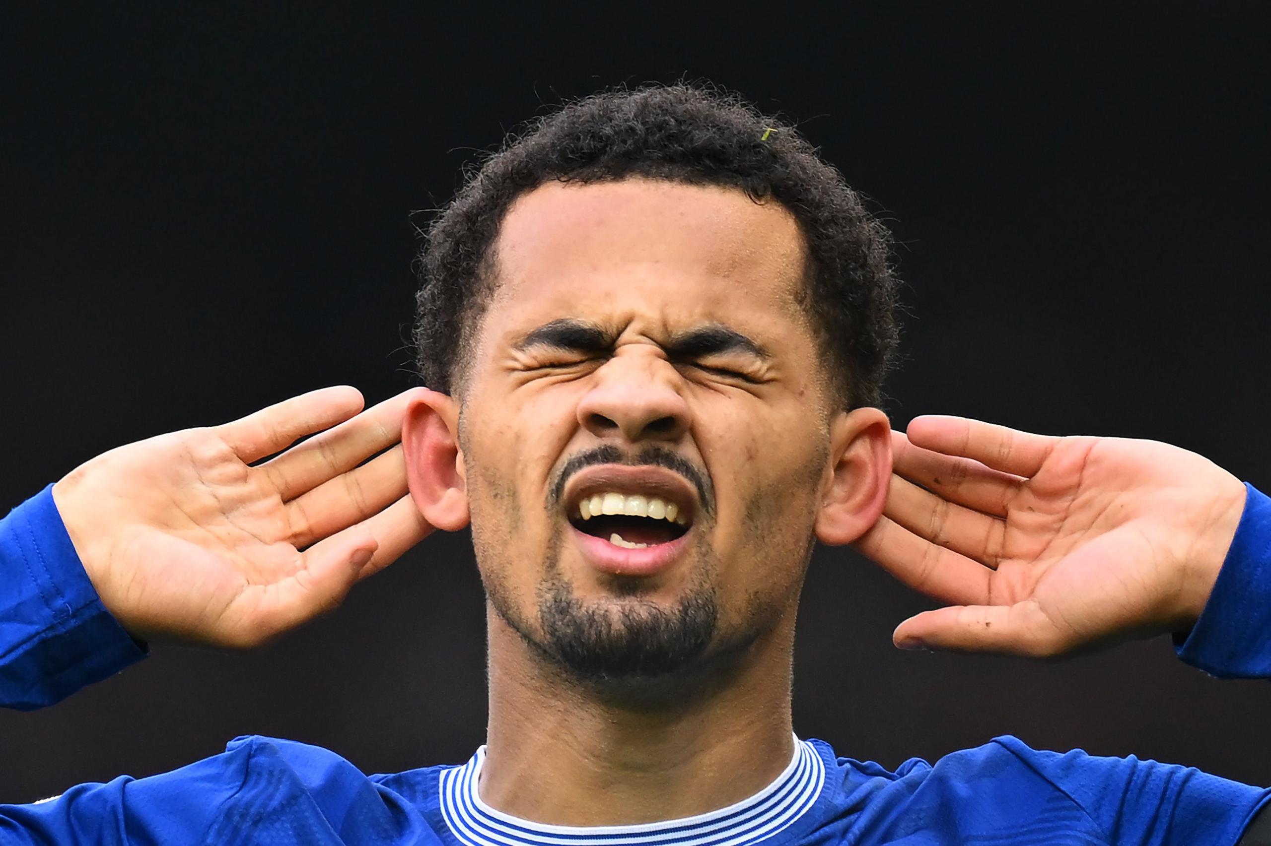 Iliman Ndiaye of Everton celebrates scoring his team's second goal against Tottenham Hotspur at Goodison Park by closing his eyes and holding his hands to his ears