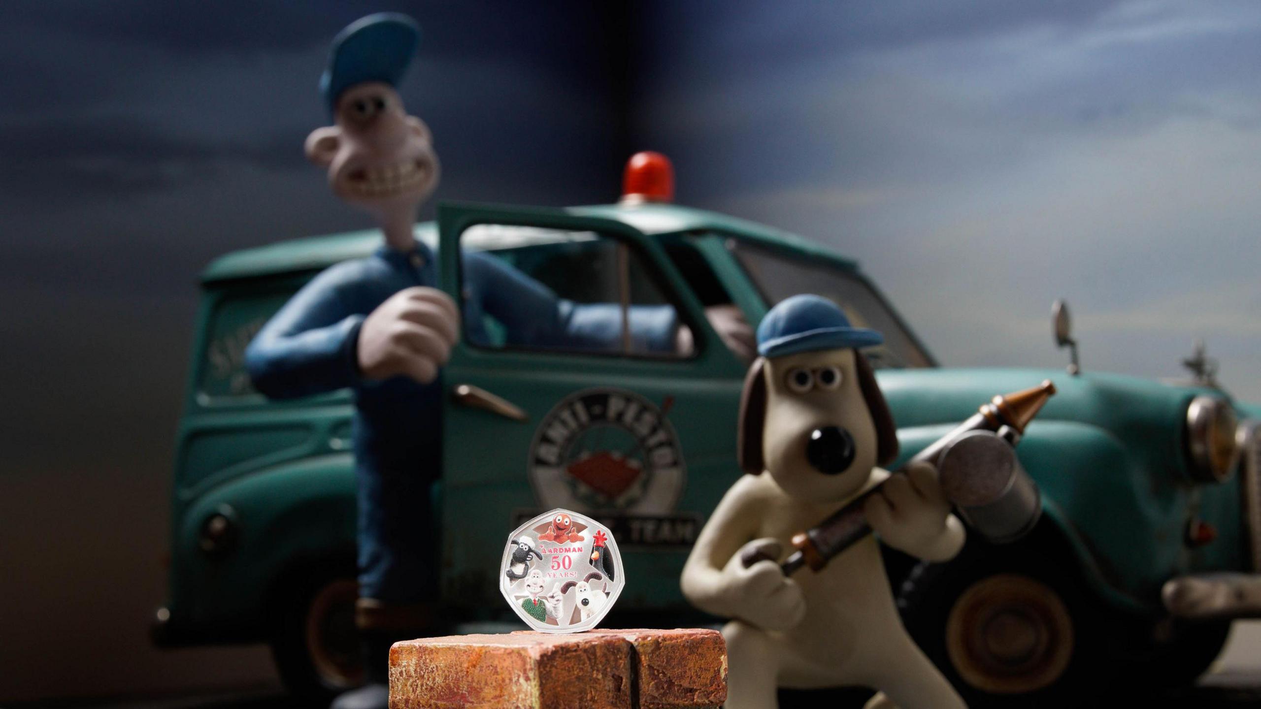 Wallace and Gromit with the new Royal Mint 50 Years of Aardman 50p