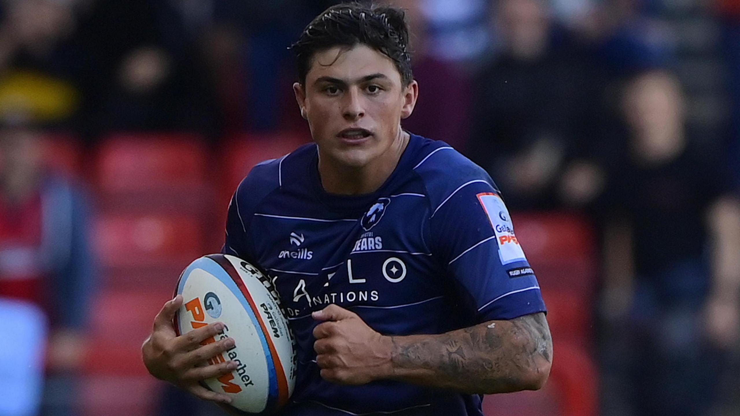 Louis Rees-Zammit in possession of a rugby ball for Bristol