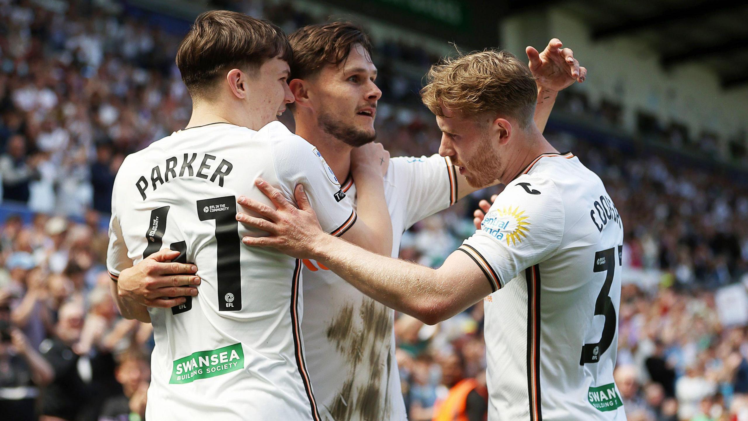 Sam Parker, Liam Cullen and Ollie Cooper celebrate a Swansea goal