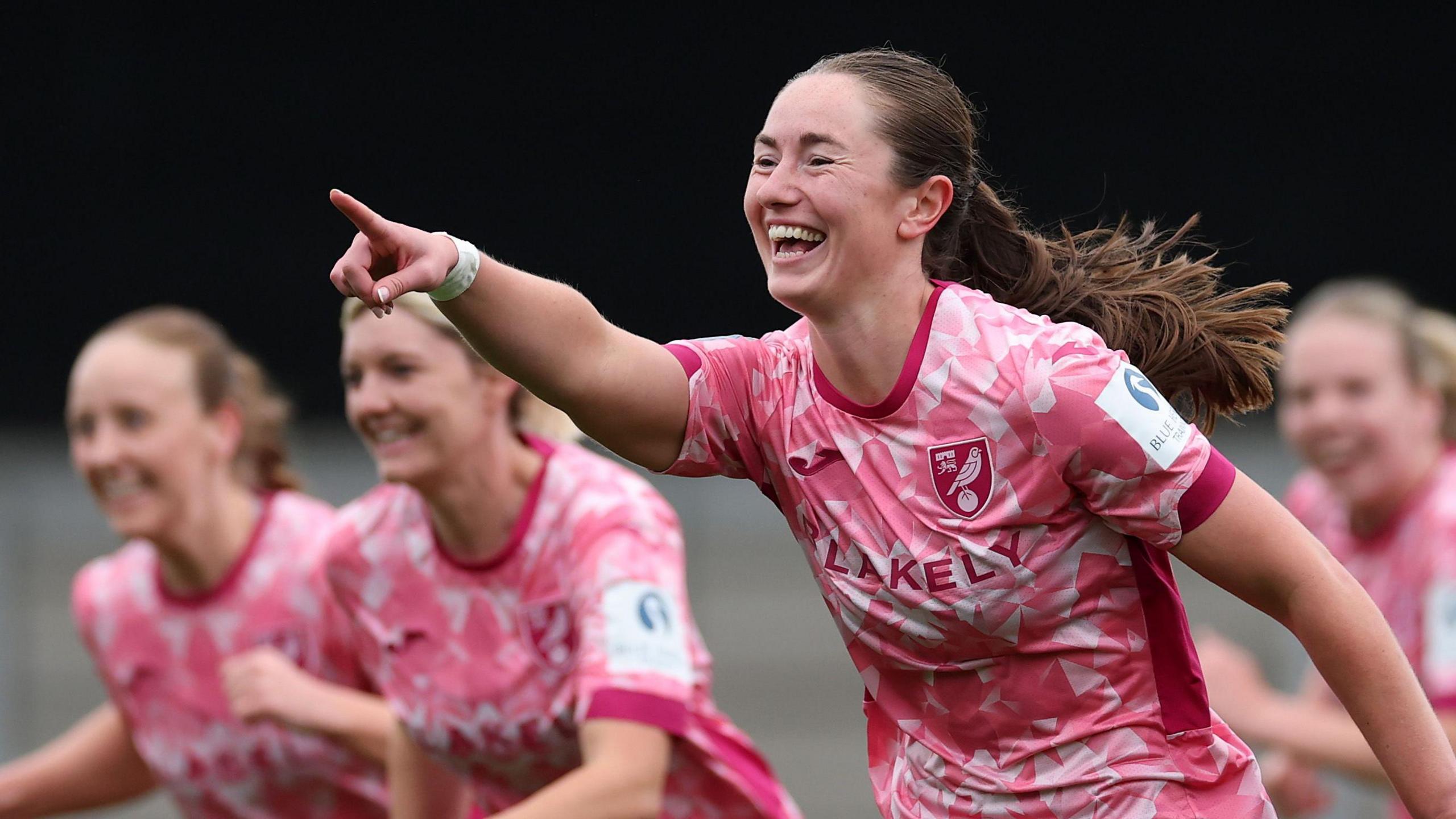 Grace Riglar celebrates after scoring in the first half for Norwich City