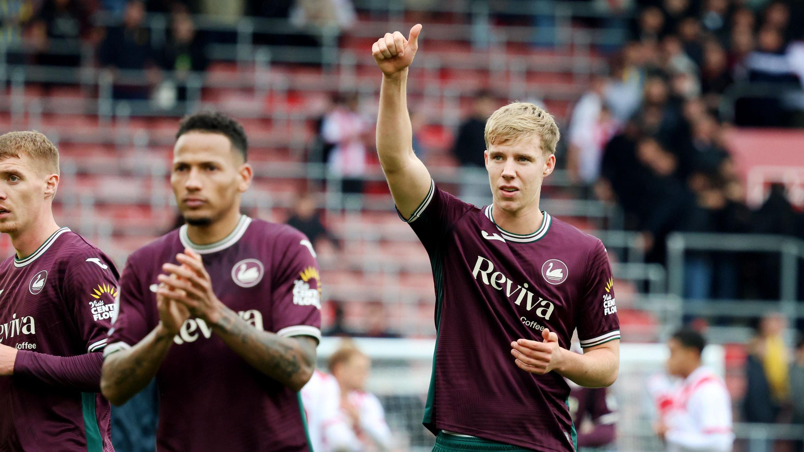 Kaelan Casey and Ronald acknowledge Swansea's fans after the draw at Southampton