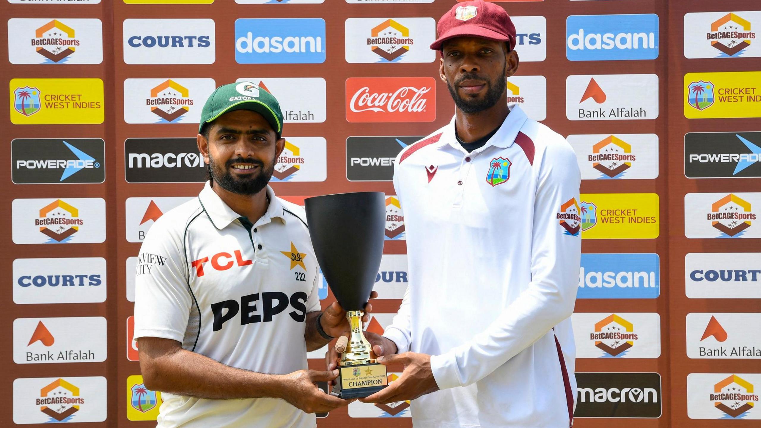 Pakistan captain Babar Azam and West Indies skipper Roston Chase with the Test series trophy after the series was drawn