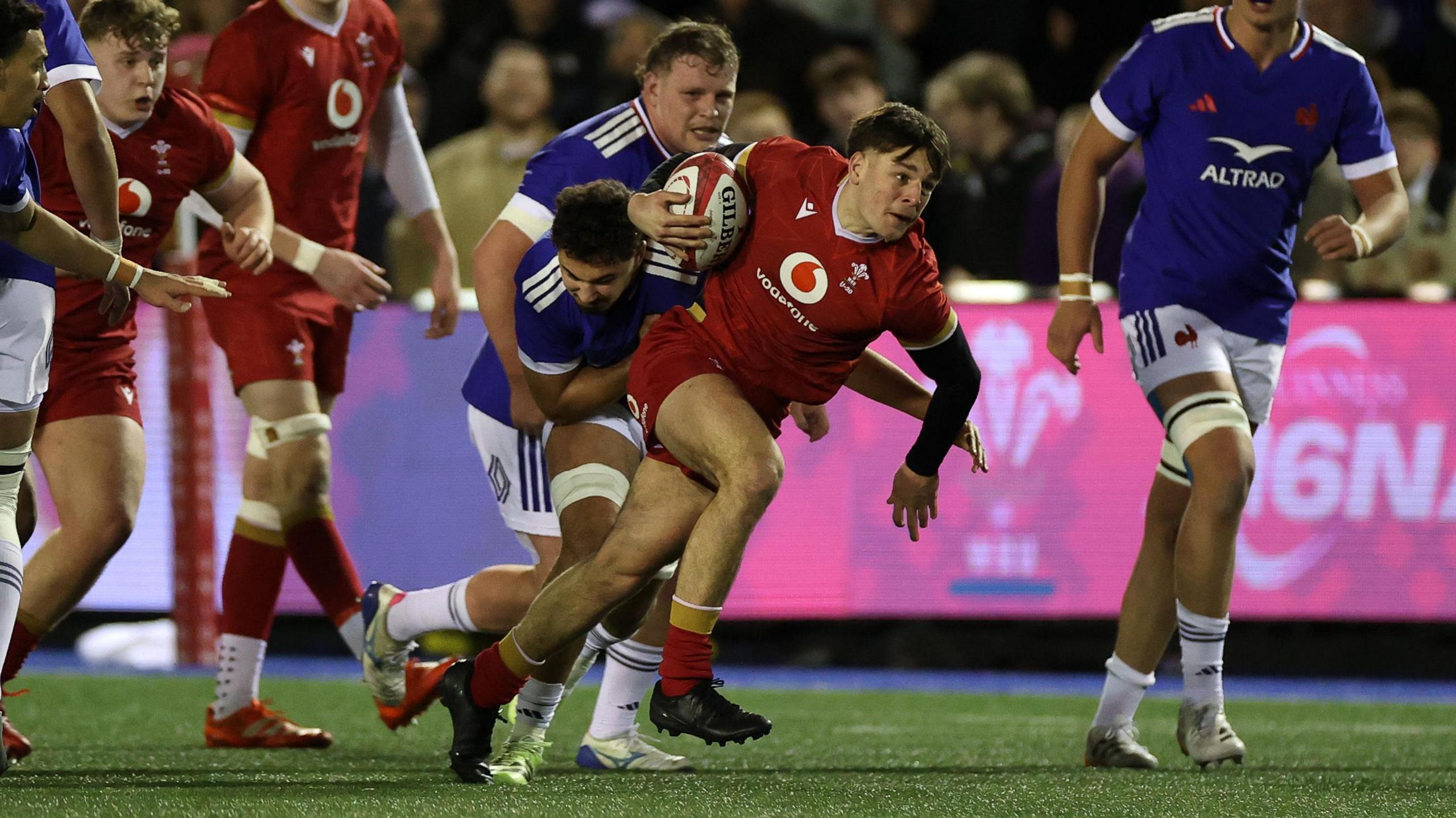 Wales Under-20s scrum-half Sion Davies carries the ball against France