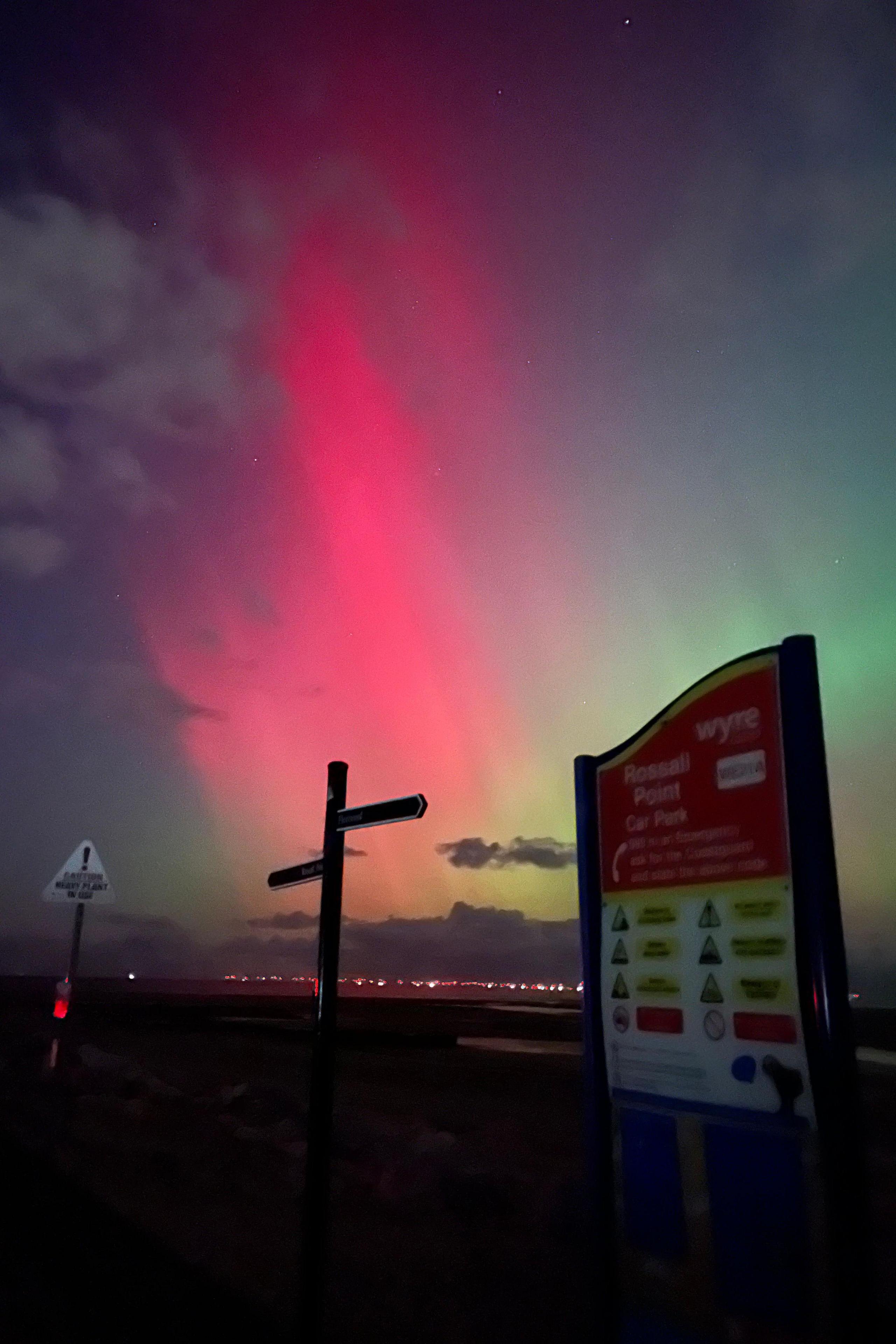 Pink colurs of the Northern Lights in the night sky over Fleetwood