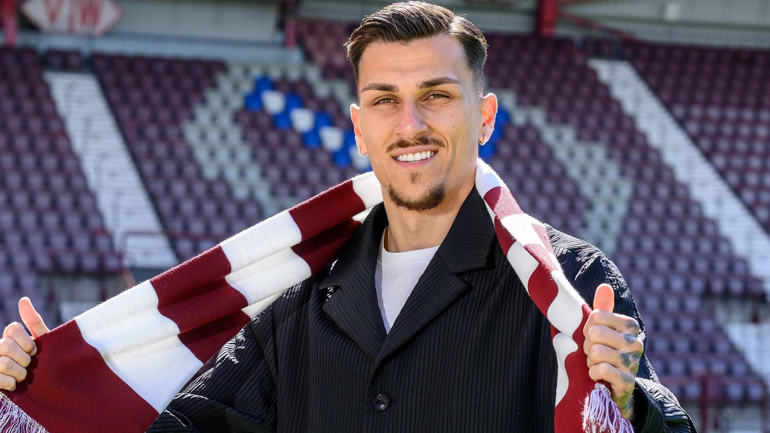 Alexandros Kyziridis with a Hearts scarf