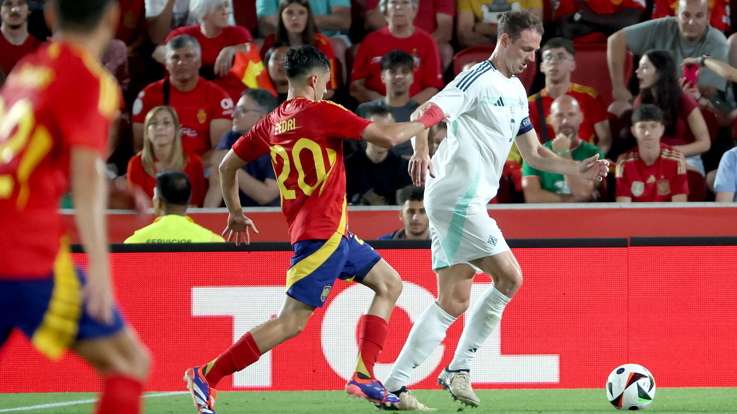 Jonny Evans in action against Spain during what was his last game for Northern Ireland