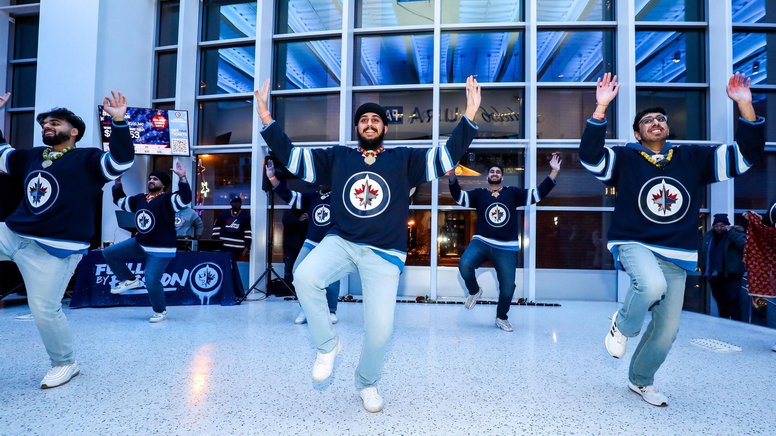 Winnipeg Bhangra Academy dancers perform prior to NHL action between the Winnipeg Jets and the Vegas Golden Knights on South Asian Heritage Night at the Canada Life Centre on December 12, 2024 in Winnipeg, Manitoba, Canada