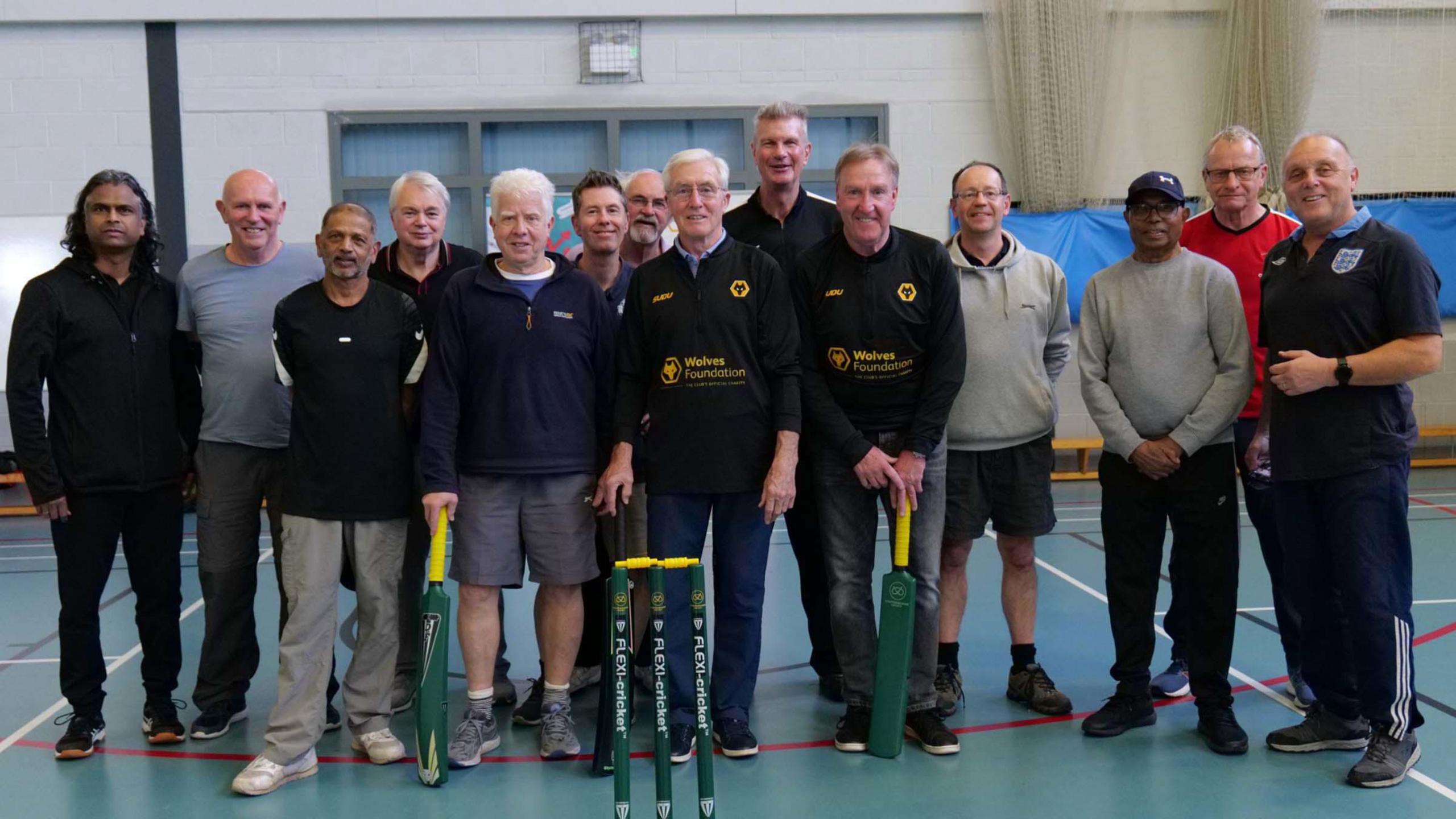 A walking football team, including former Wolverhampton Wanderers players John Richards and Steve Daley are pictured inside a sports hall