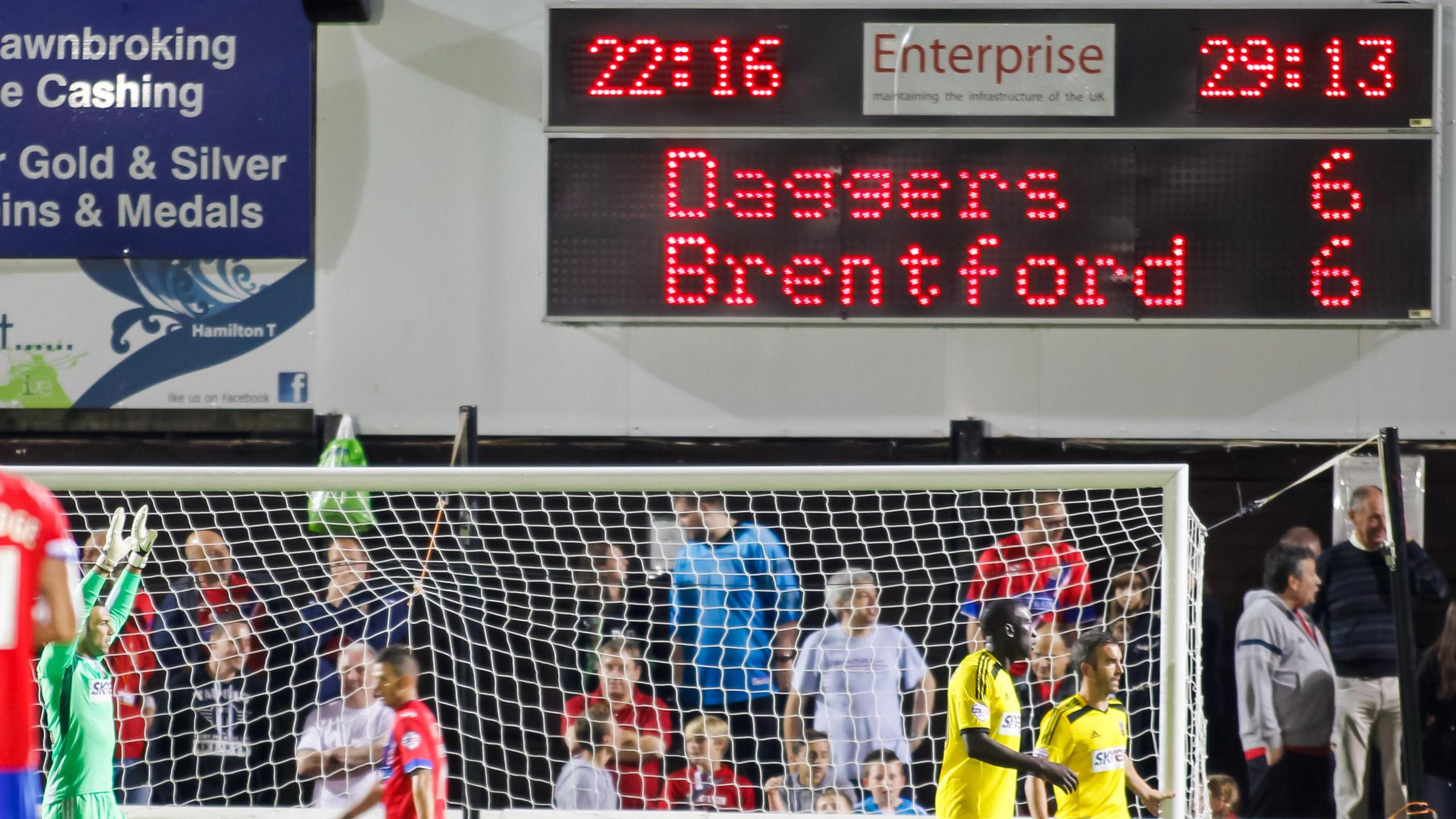 Scoreboard reading 6-6 in a game between Dagenham & Redbridge against Brentford